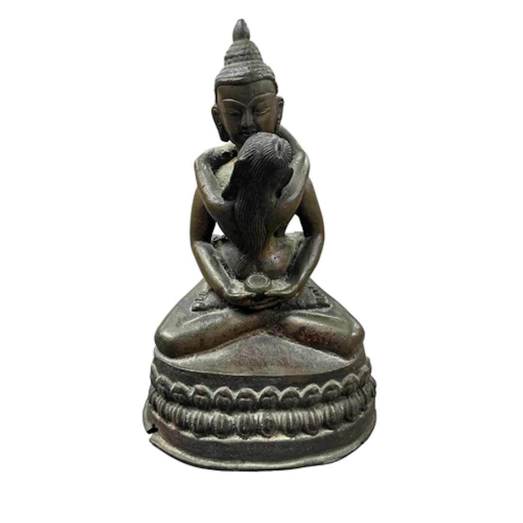 A small bronze Tibetan Buddhist figure of Yab-Yum, 15cm high...