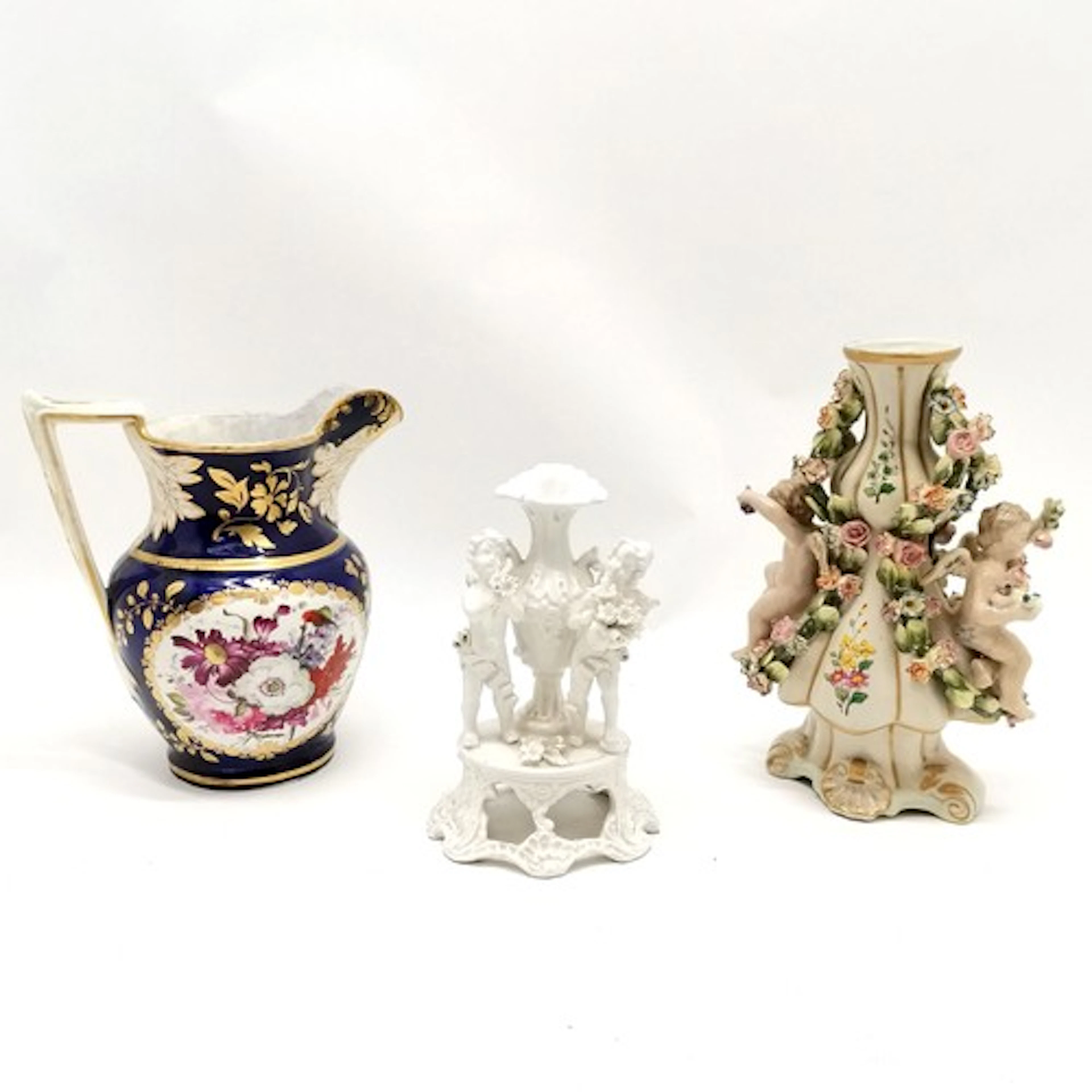 Continental ornate vase with cherub & flower detail & crosse...