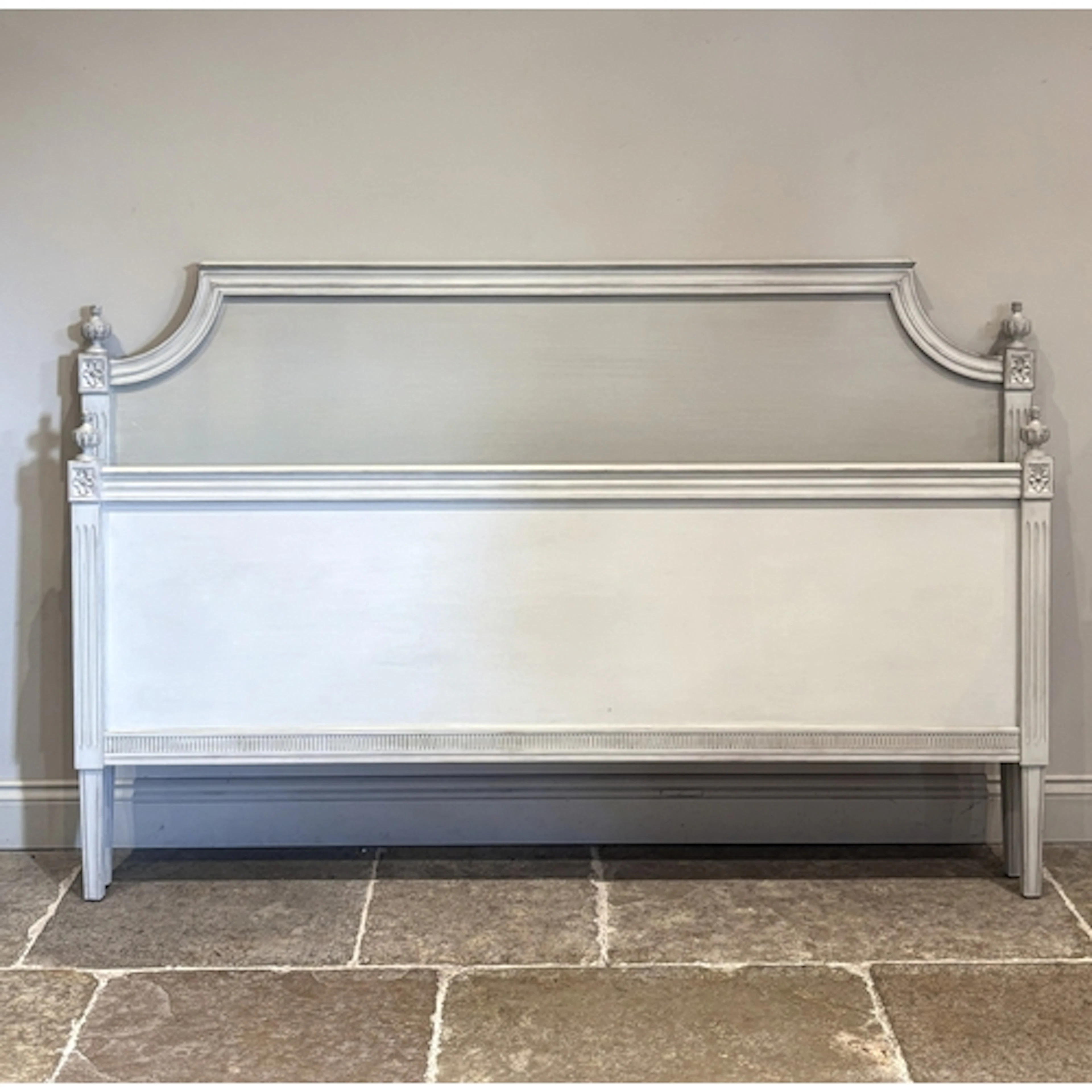 A taupe painted wooden super king bed frame, with slats and ...