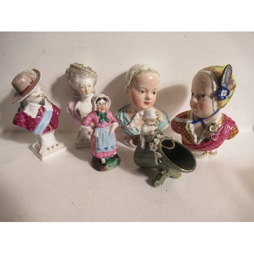 Two pairs of continental porcelain busts, together with two ...
