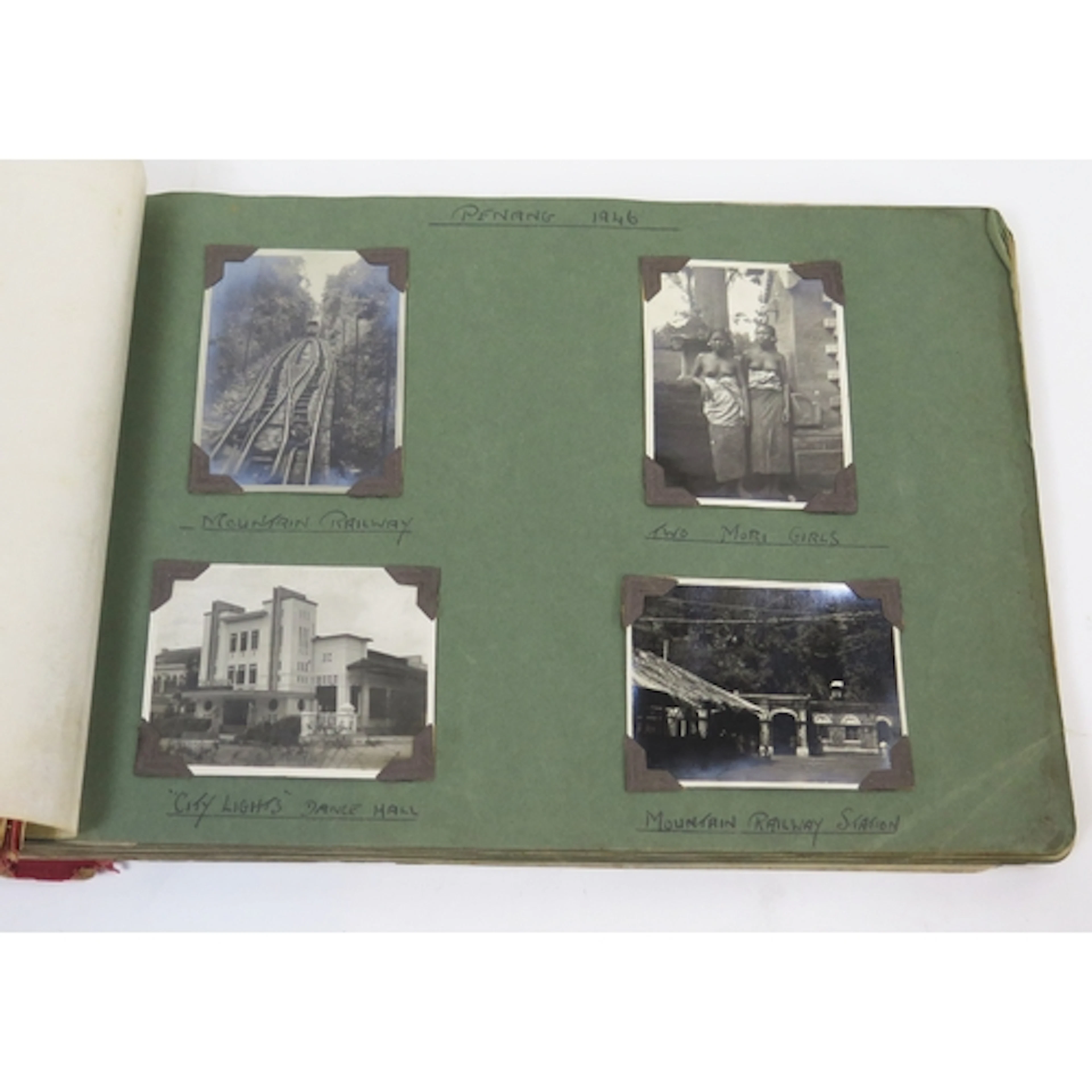 A WWII period photograph album containing photos from the fa...