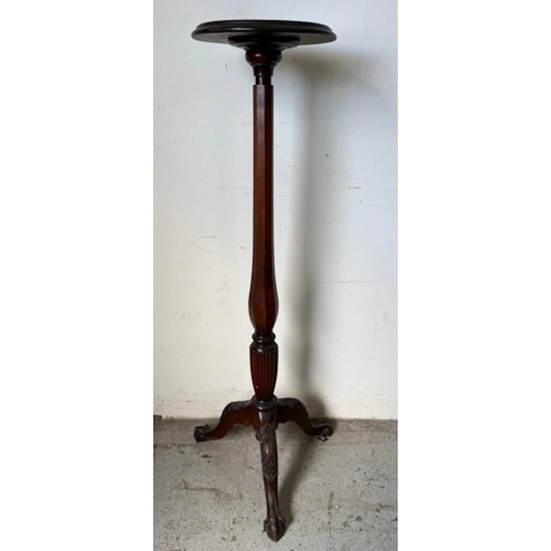 A Mahogany torchere stand or plant stand , circular top with...