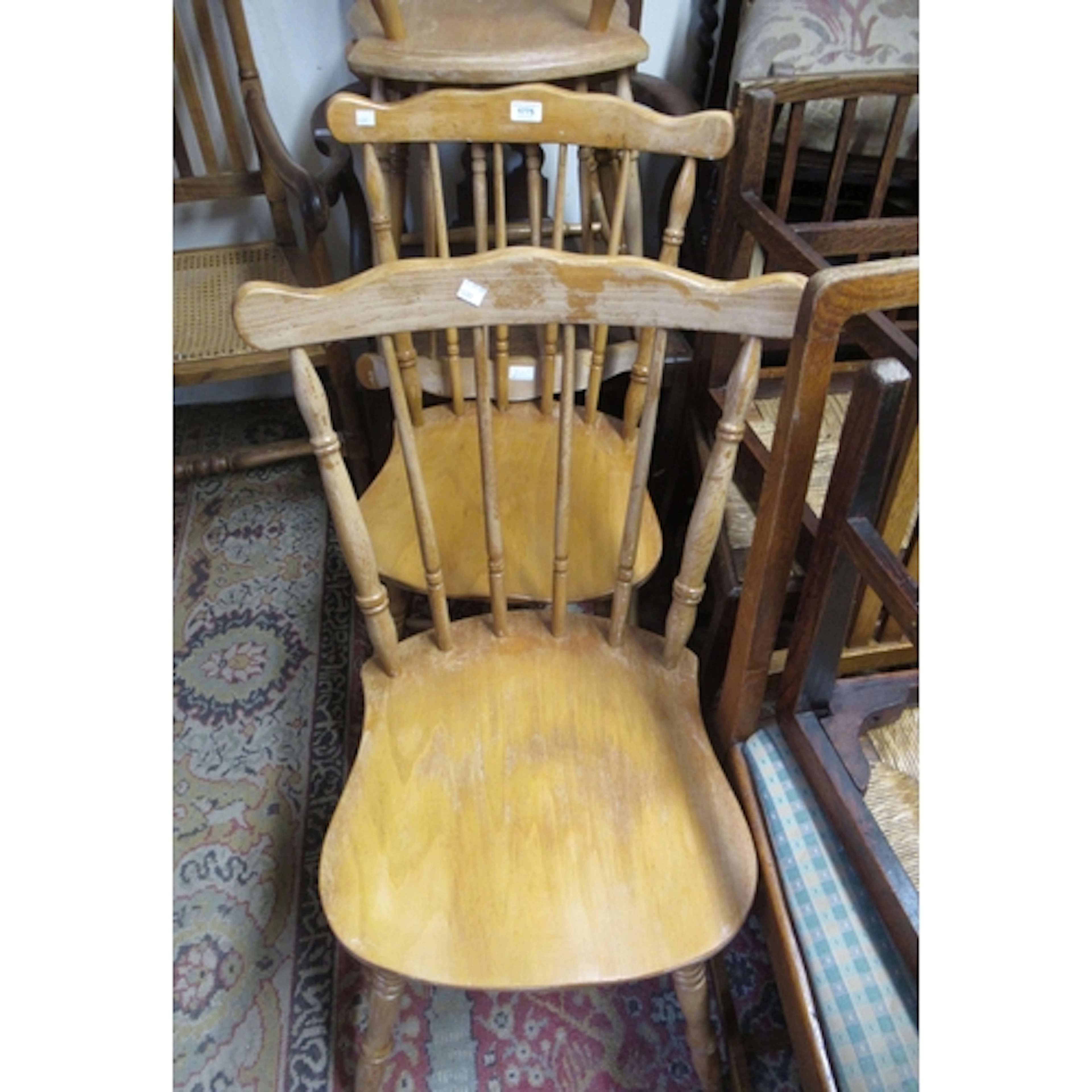 Set of four 20th Century stick back kitchen chairs, on turne...