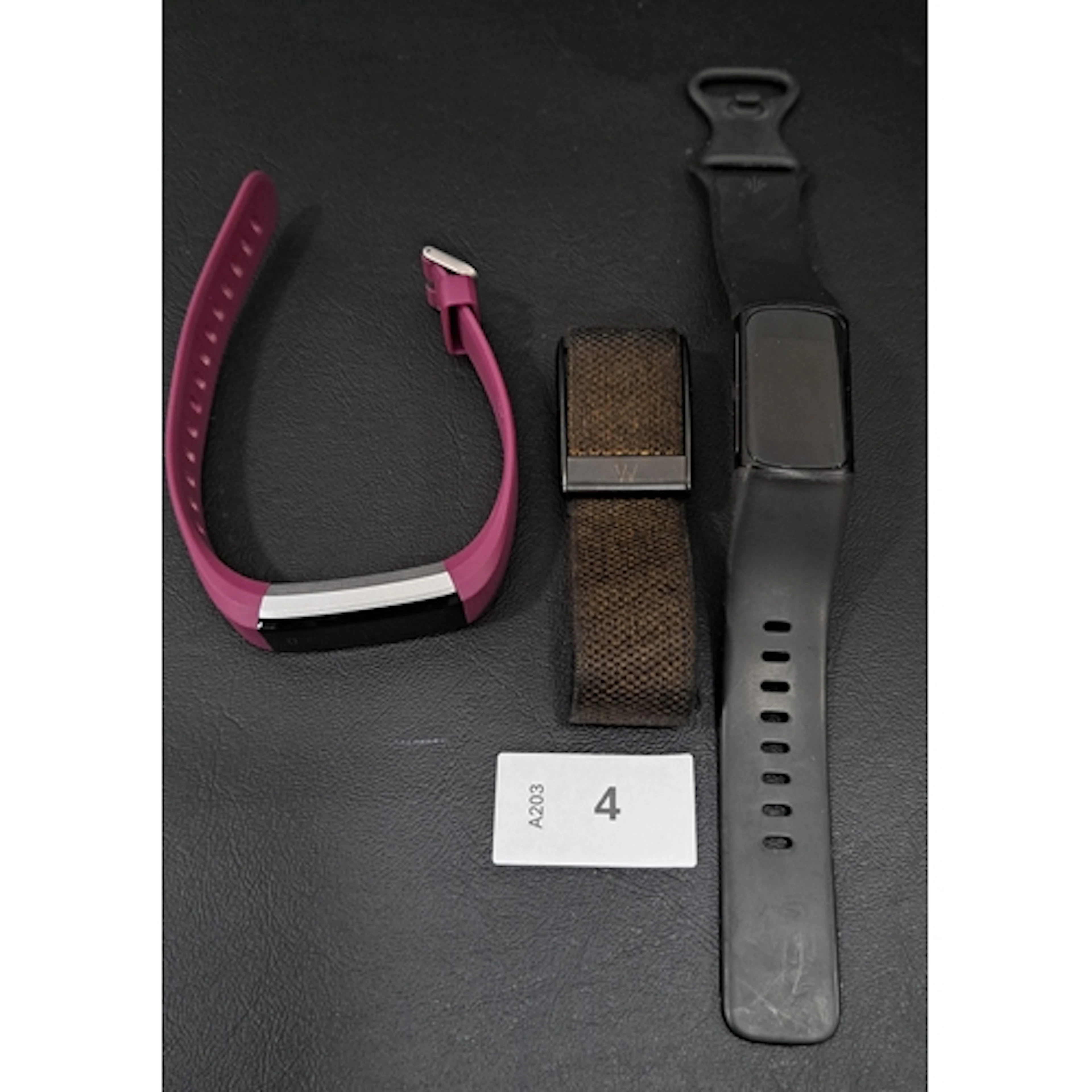 THREE FITNESS TRACKERS COMPRISING FITBIT CHARGE 5, GENERIC F...
