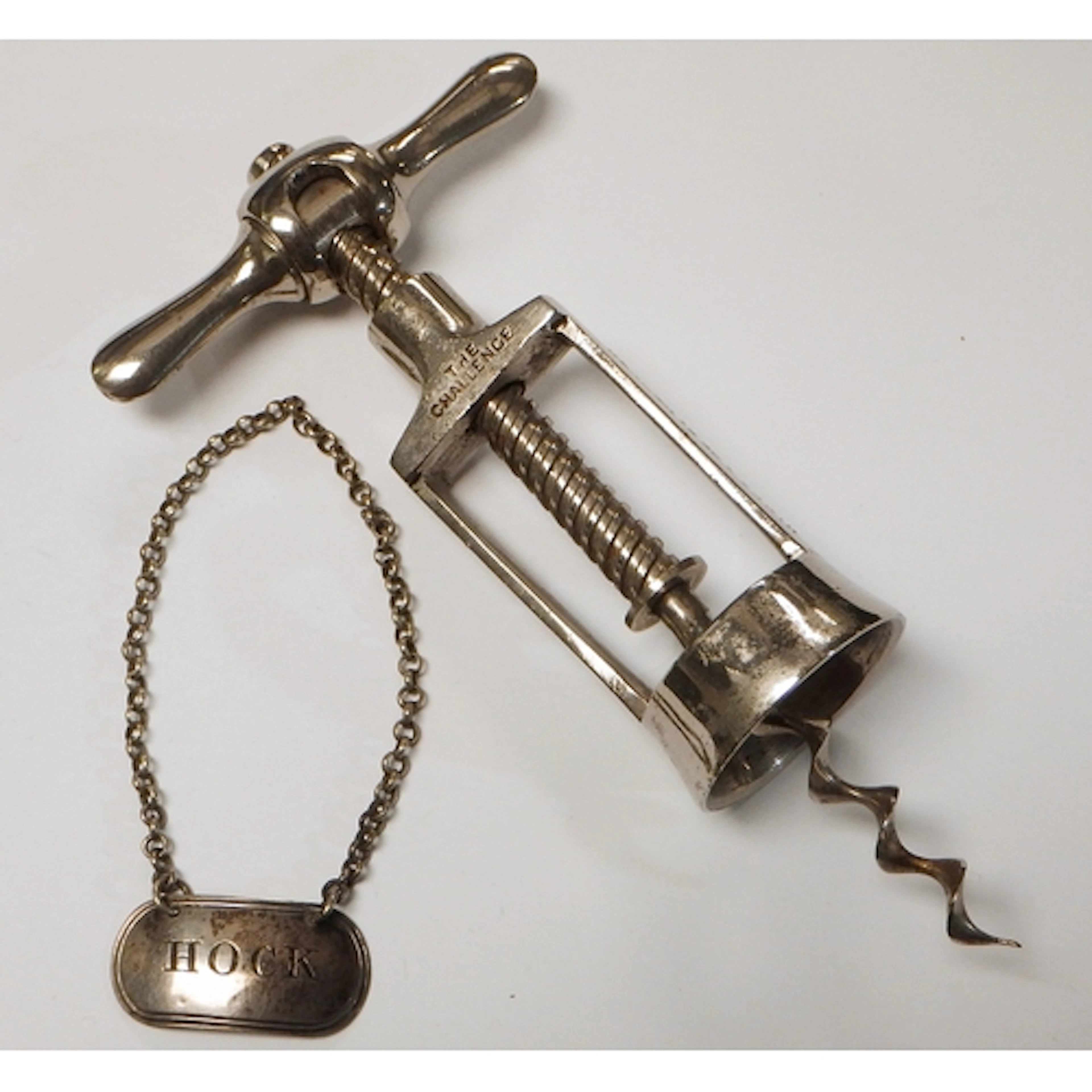 A patent corkscrew "The Challenge" bearing Hicks & Co Plymou...