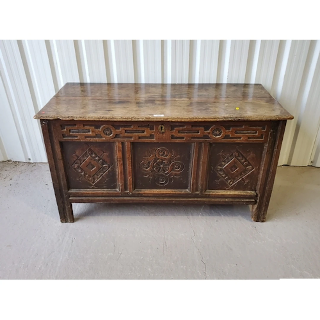 A 17th Century joined oak Coffer with lozenge carved three p...