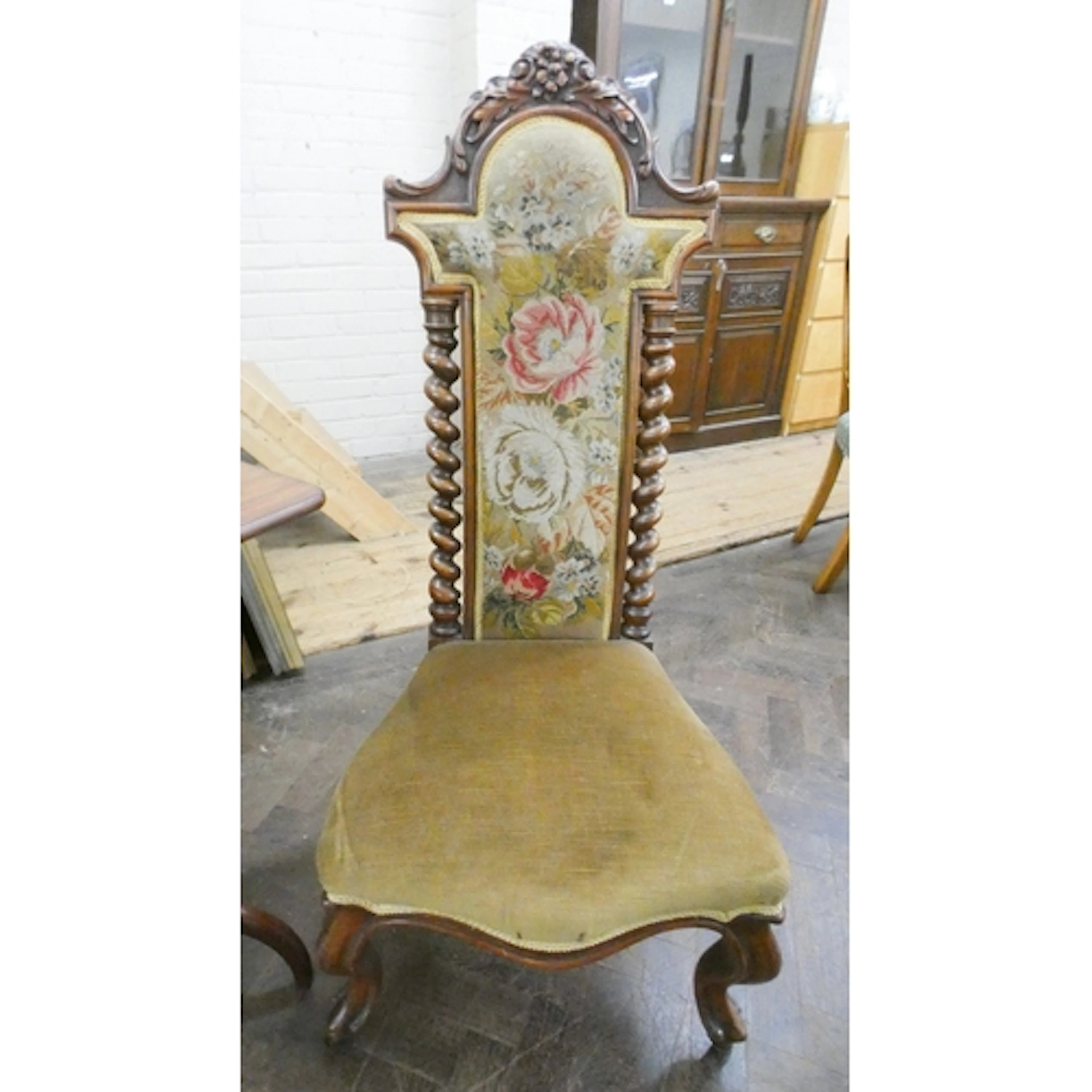 A Victorian walnut occasional chair with tapestry upholstere...