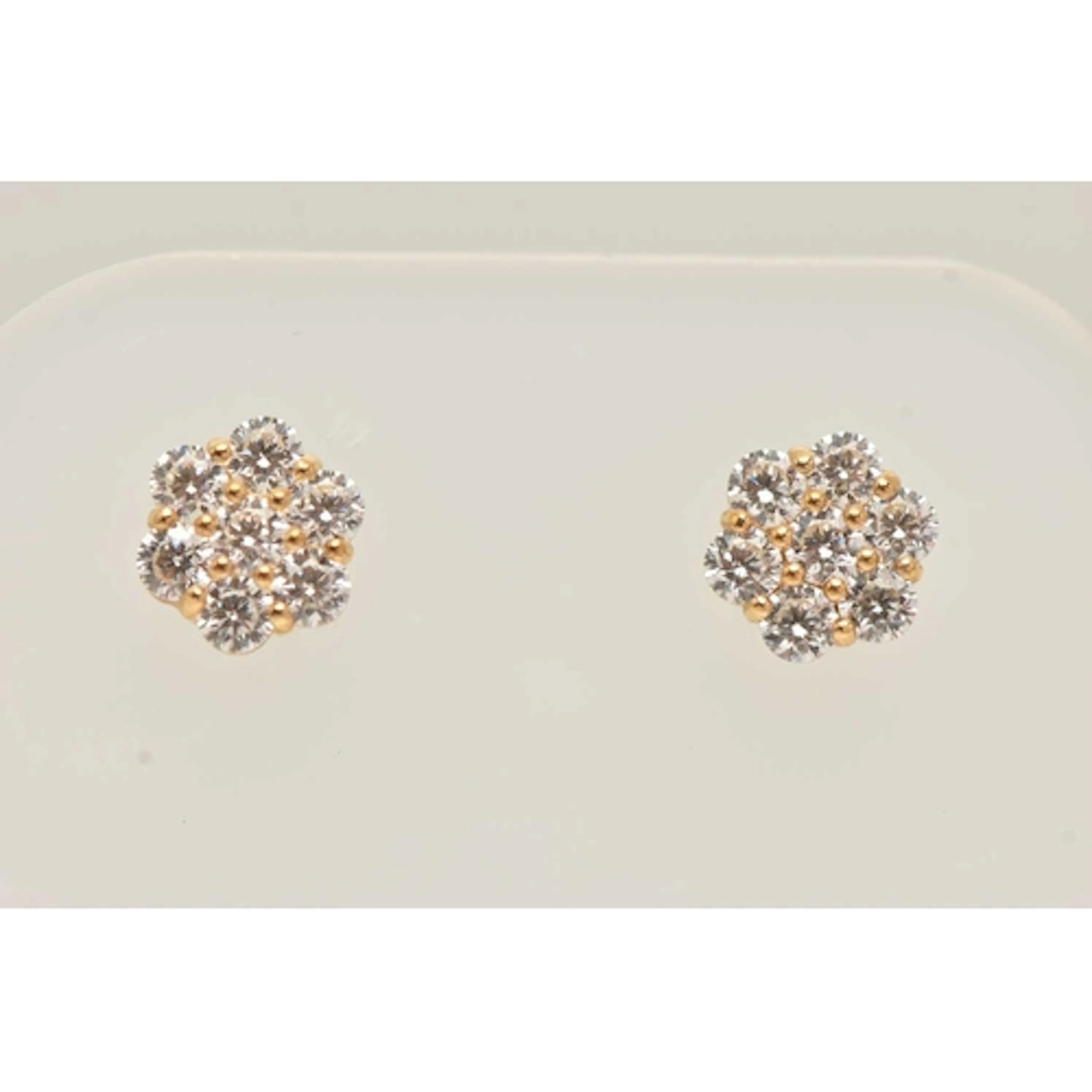 A PAIR OF YELLOW METAL AND CUBIC ZIRCONIA EARRINGS, floral c...