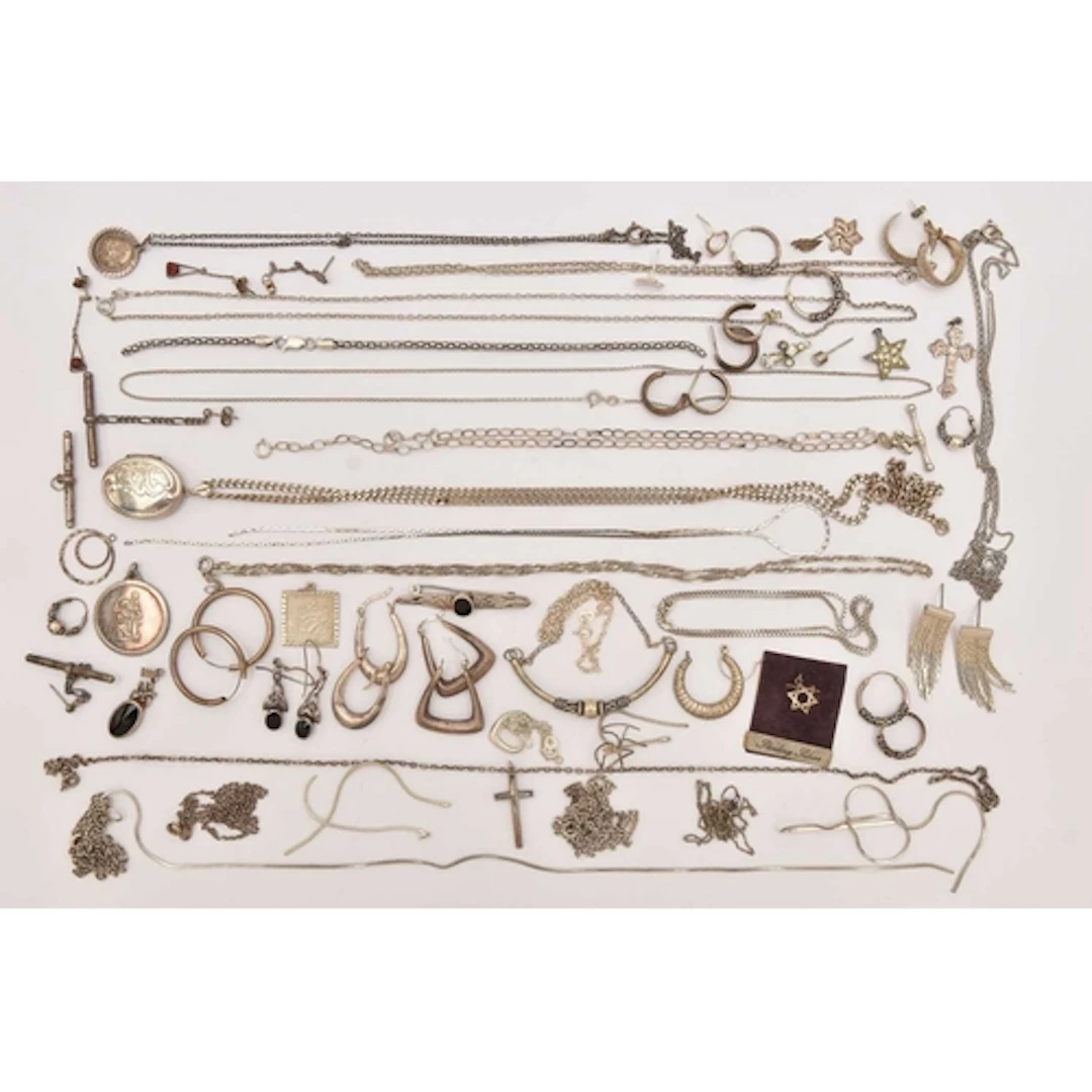 AN ASSORTMENT OF WHITE METAL JEWELLERY, to include earrings,...