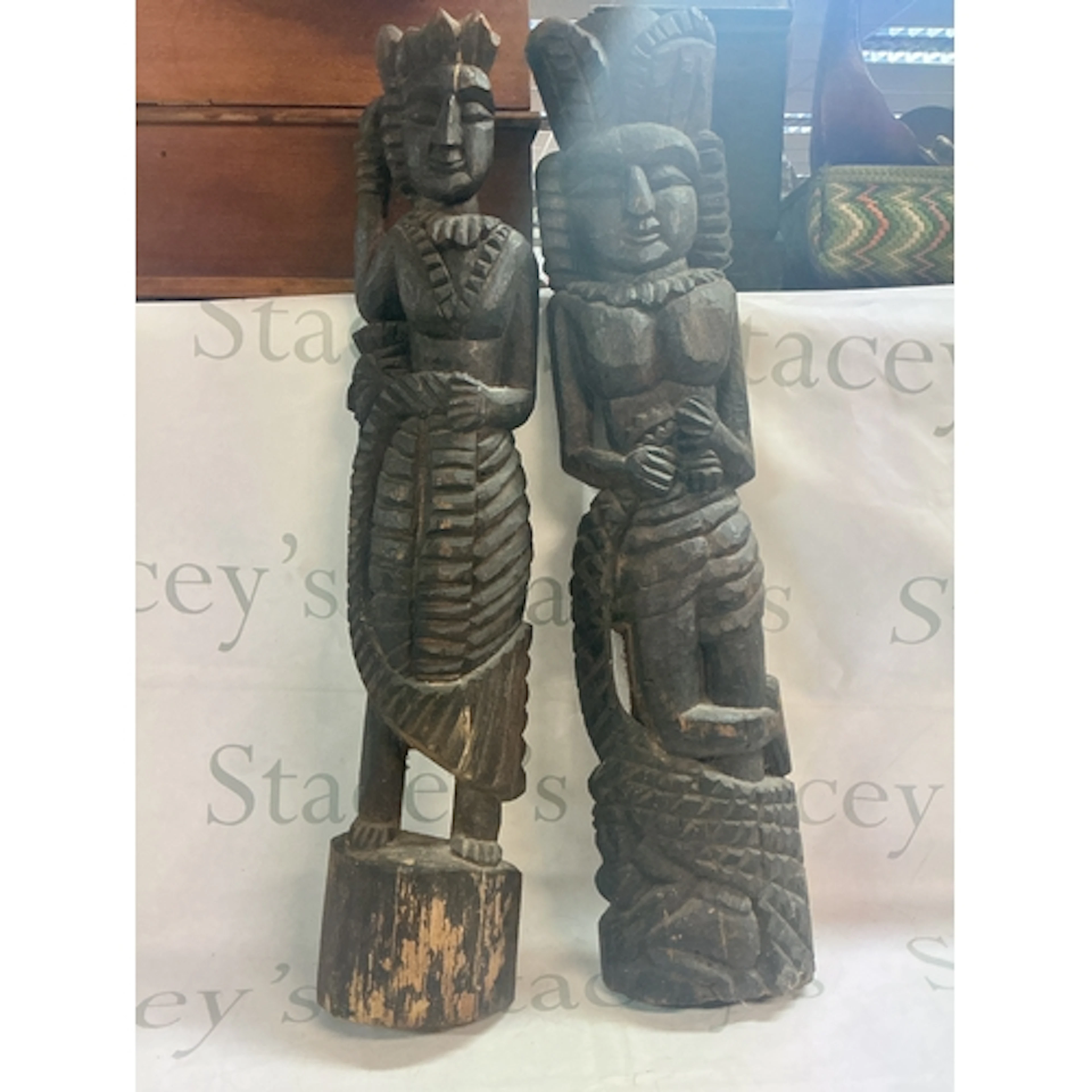 A pair of wooden figure carvings, 67cm tall