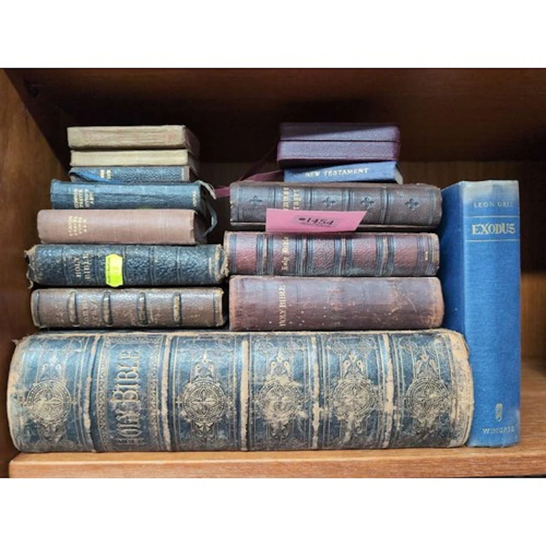 Collection of religious books, mostly in a leather-bound inc...