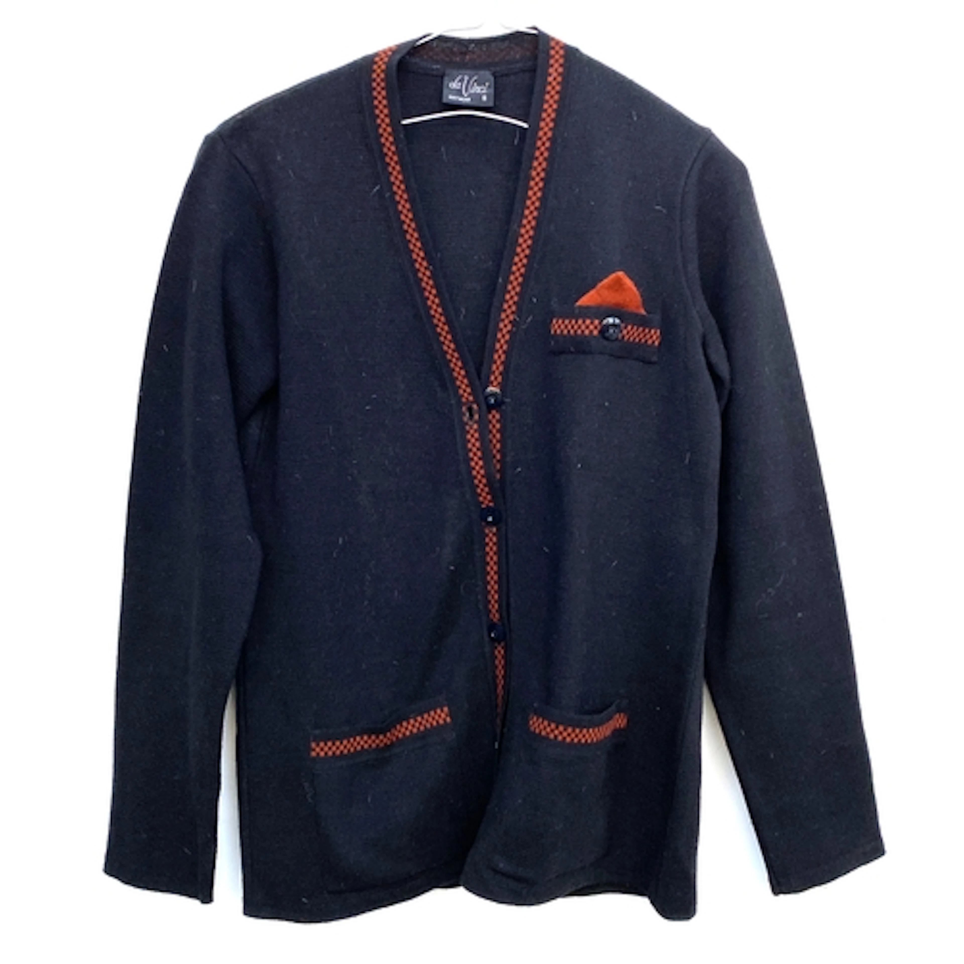 A Da Vinci navy wool cardigan with red trim and matching ski...