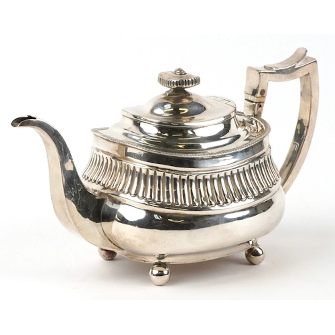 William Hunter II, George III silver teapot raised on four b...