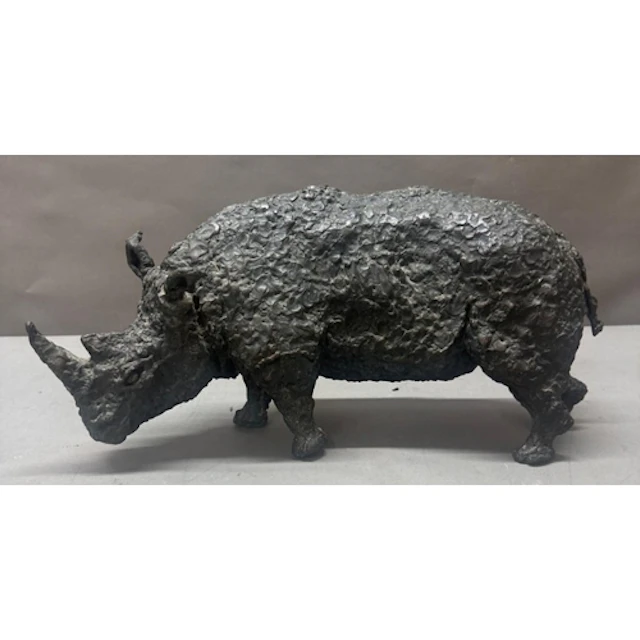 A bronze sculpture of a rhinoceros. Length 48cm height 26cm...