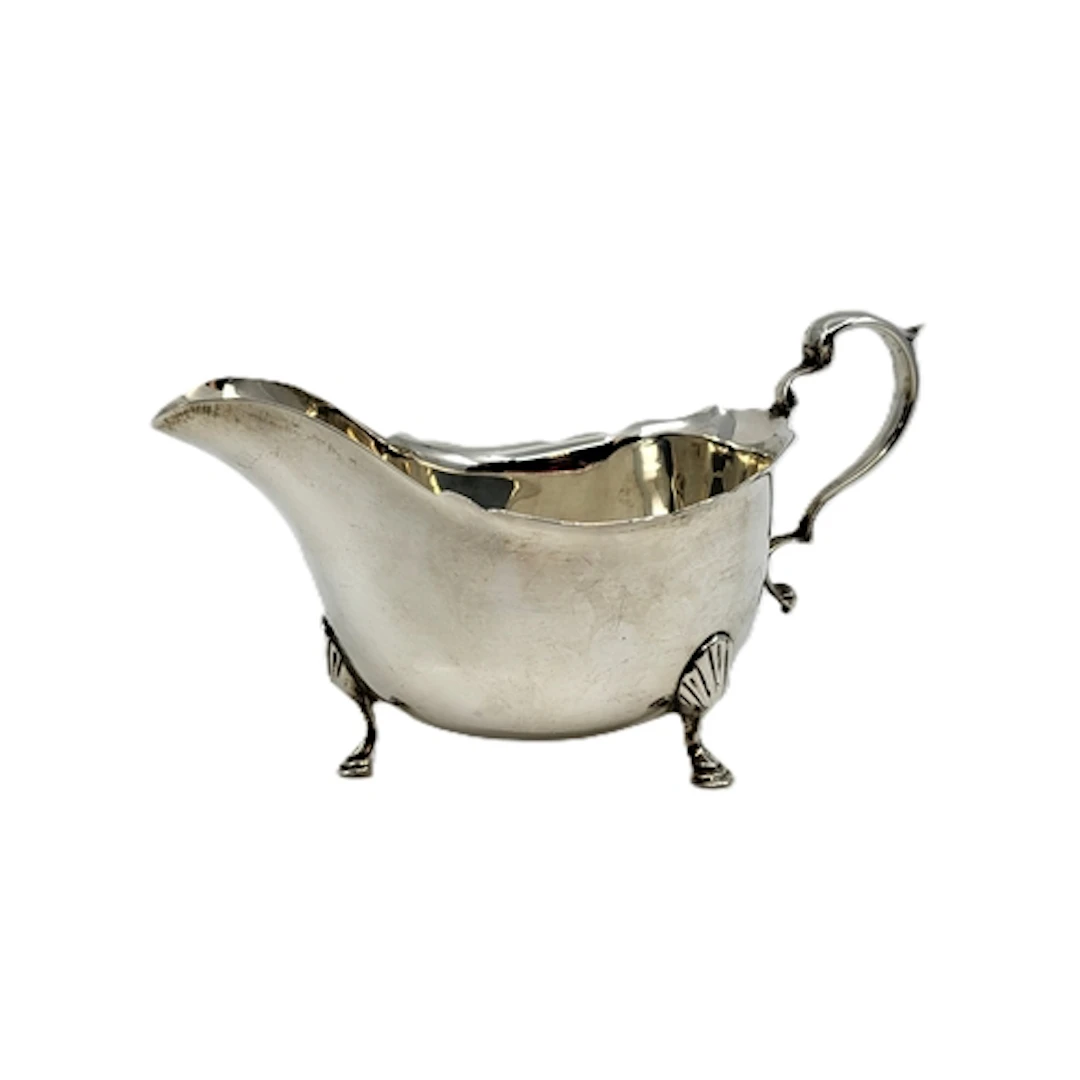 A PRE-WAR STERLING SILVER HELMET-SHAPED SAUCE BOAT, Birmingh...