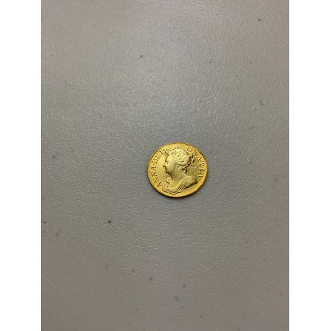 1714 Queen Anne Guinea, weight 8.1 grams.