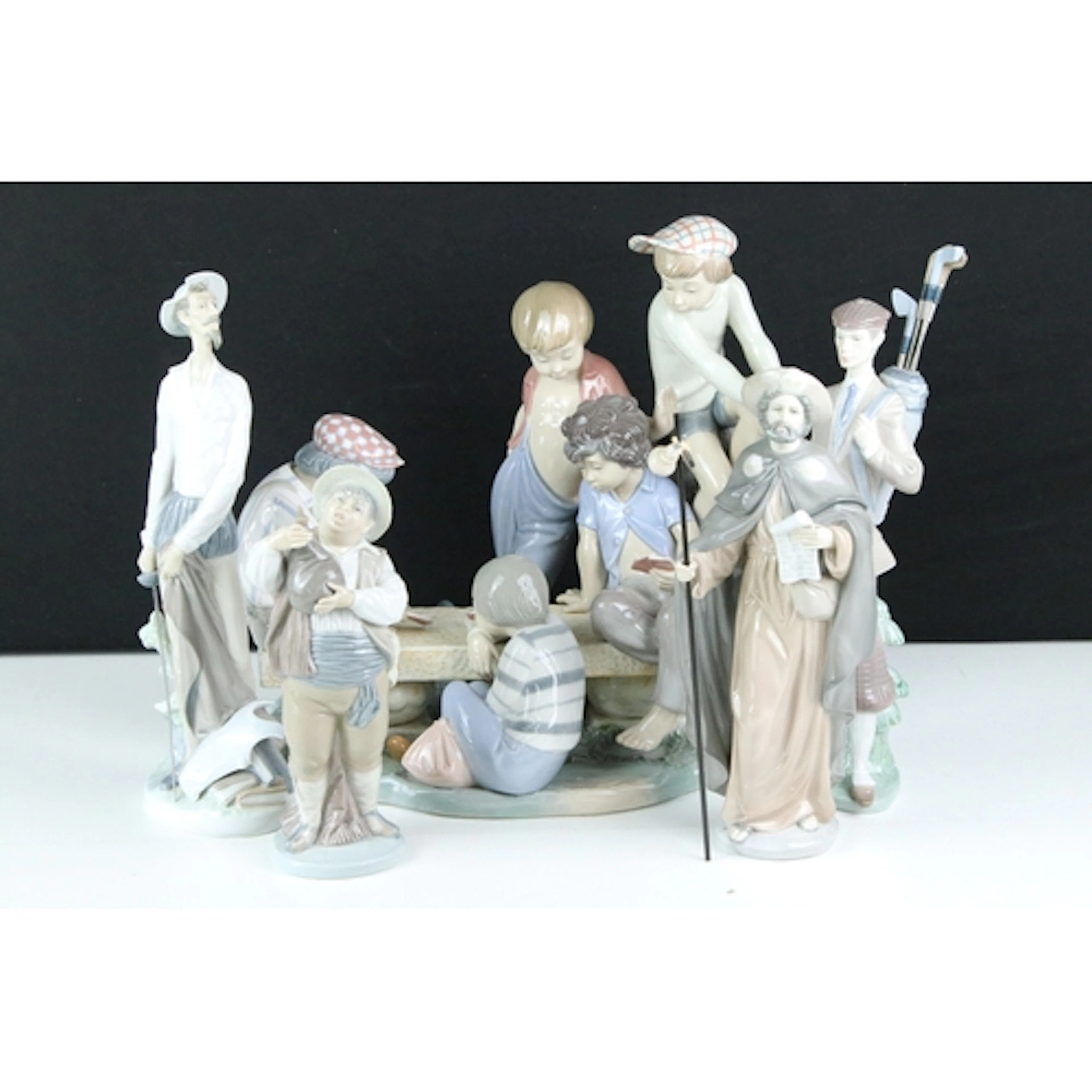 Nao by Lladro figural group of five young boys playing cards...