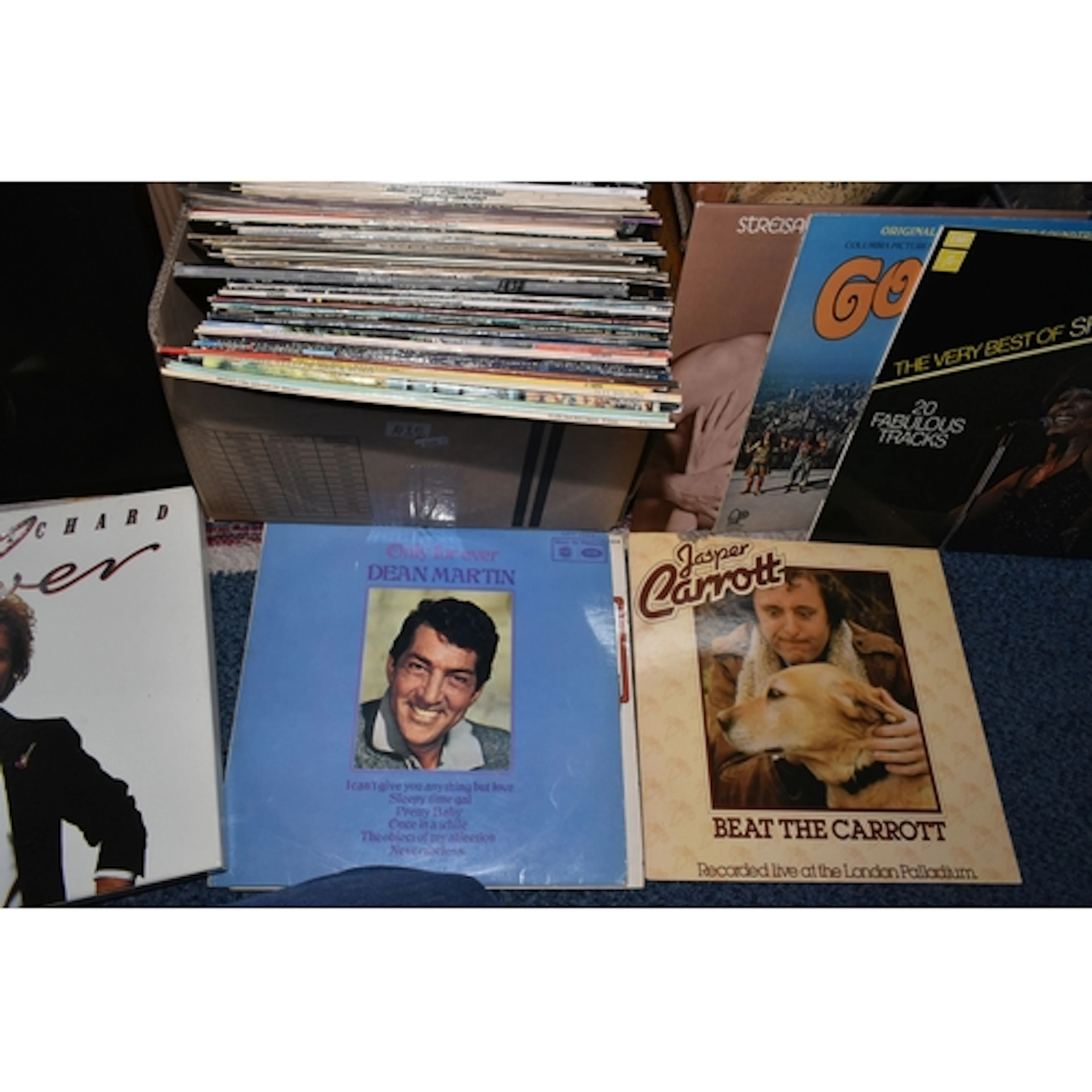 A BOX OF VINYL RECORDS from artists such as The Beatles, Dea...
