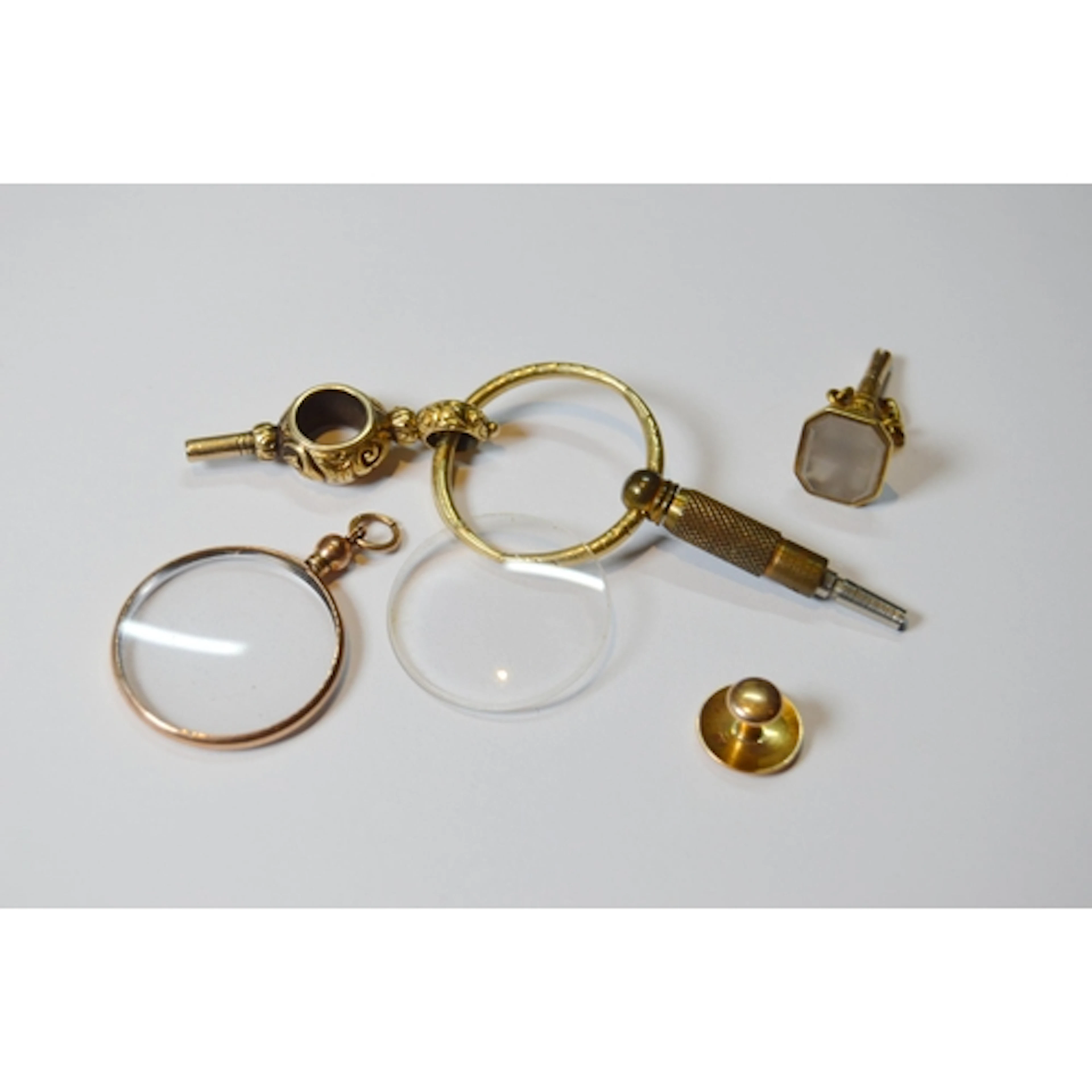 Two Victorian watch keys, one inset with a shaped matrix, th...