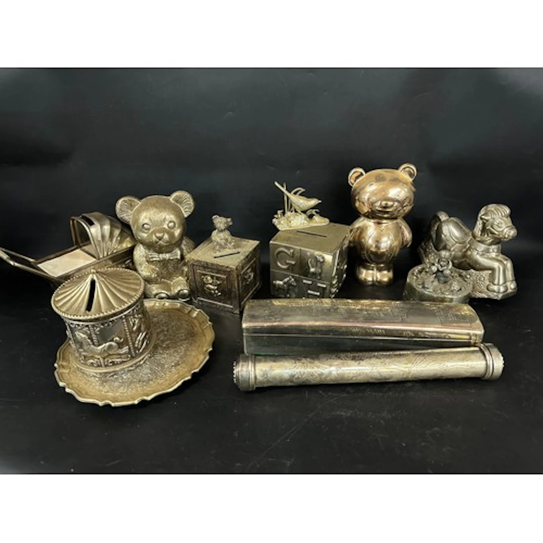 A collection of plated money boxes, mainly baby / Christenin...