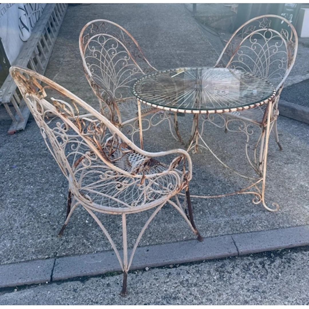 A vintage wire work and wrought iron garden patio set compri...