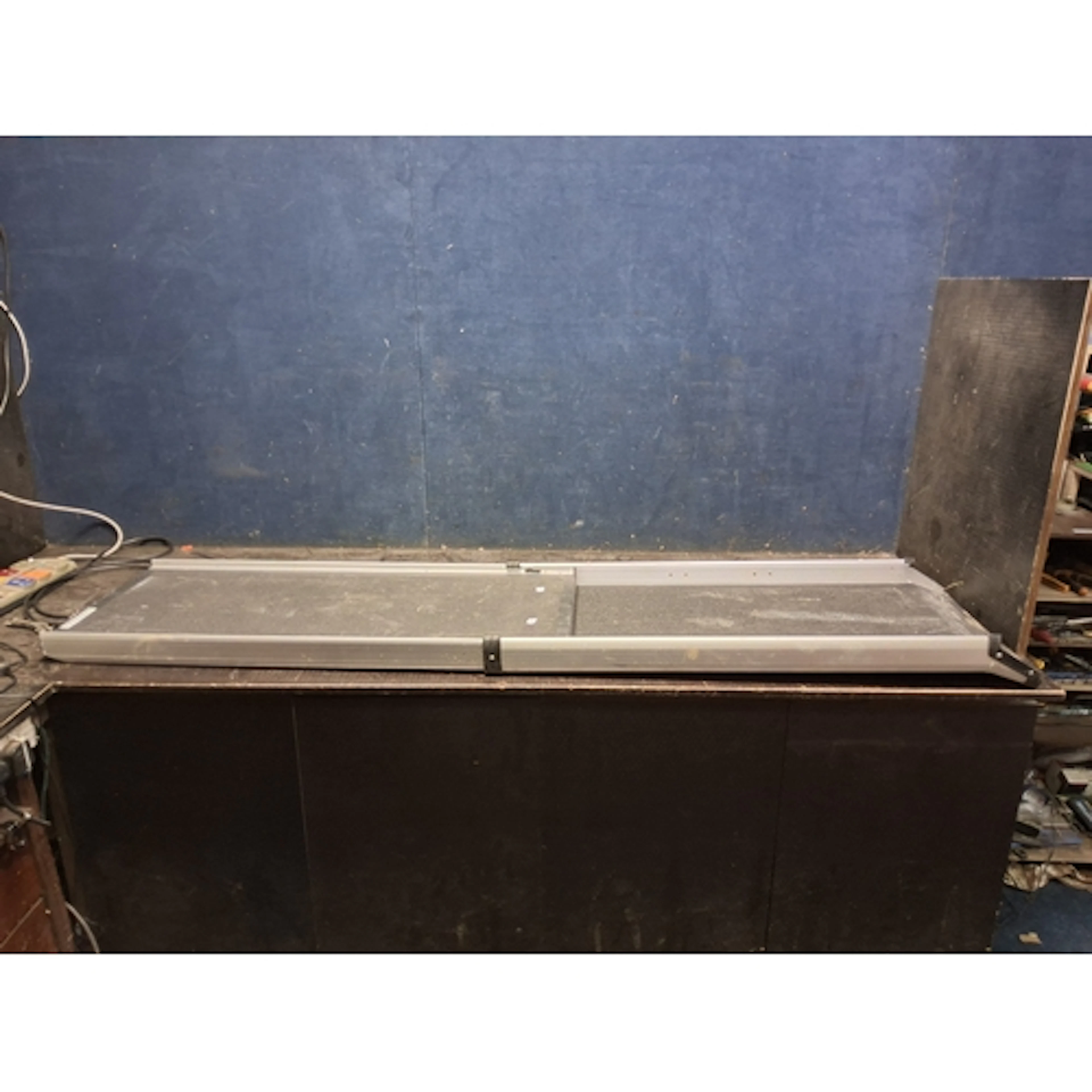 A HEWITT AND BLUE TELESCOPIC DOG RAMP with a non-slip surfac...