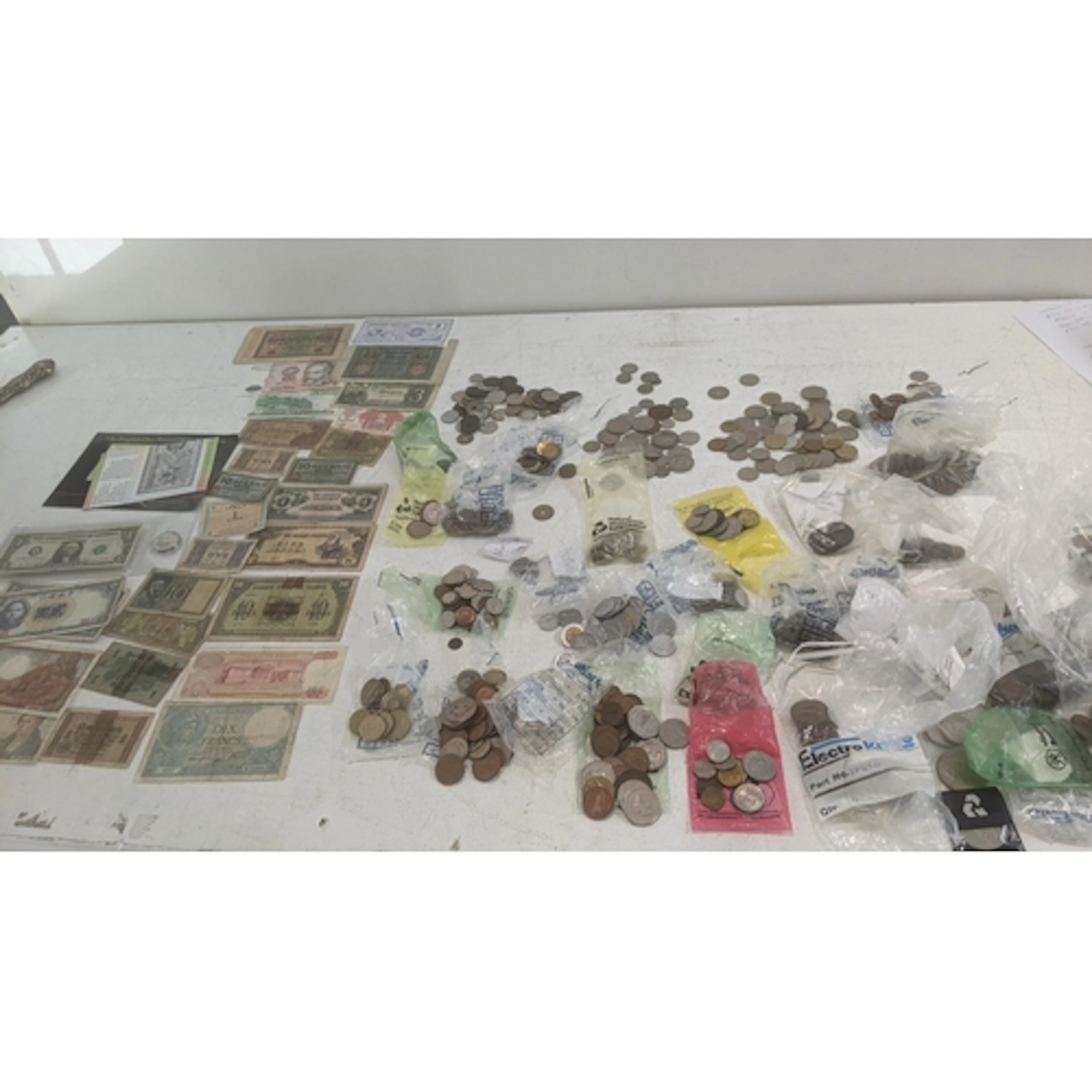 Coins and banknotes to include coins from around the world f...
