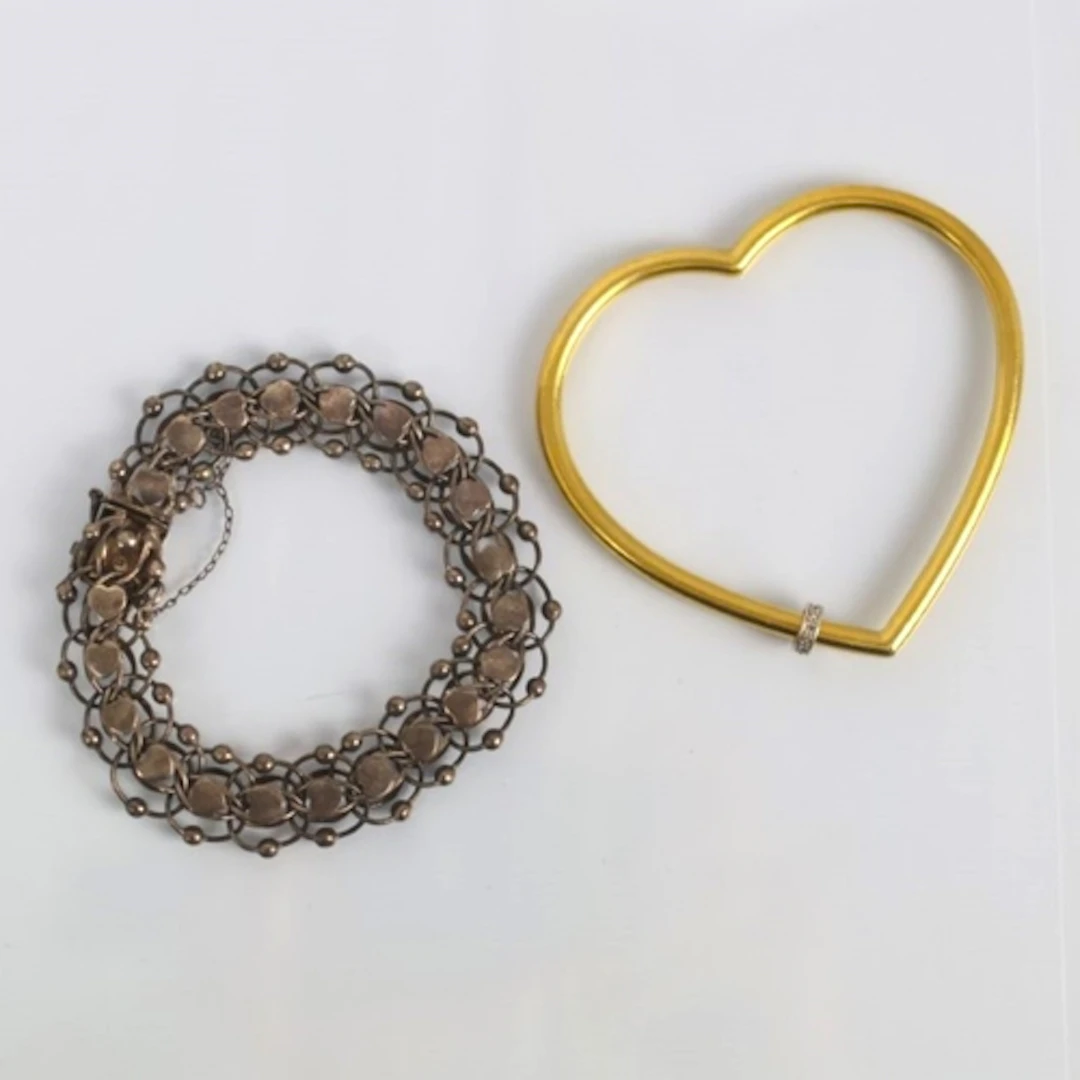 A late 20th century heart shaped bangle, by Franklin Mint, t...