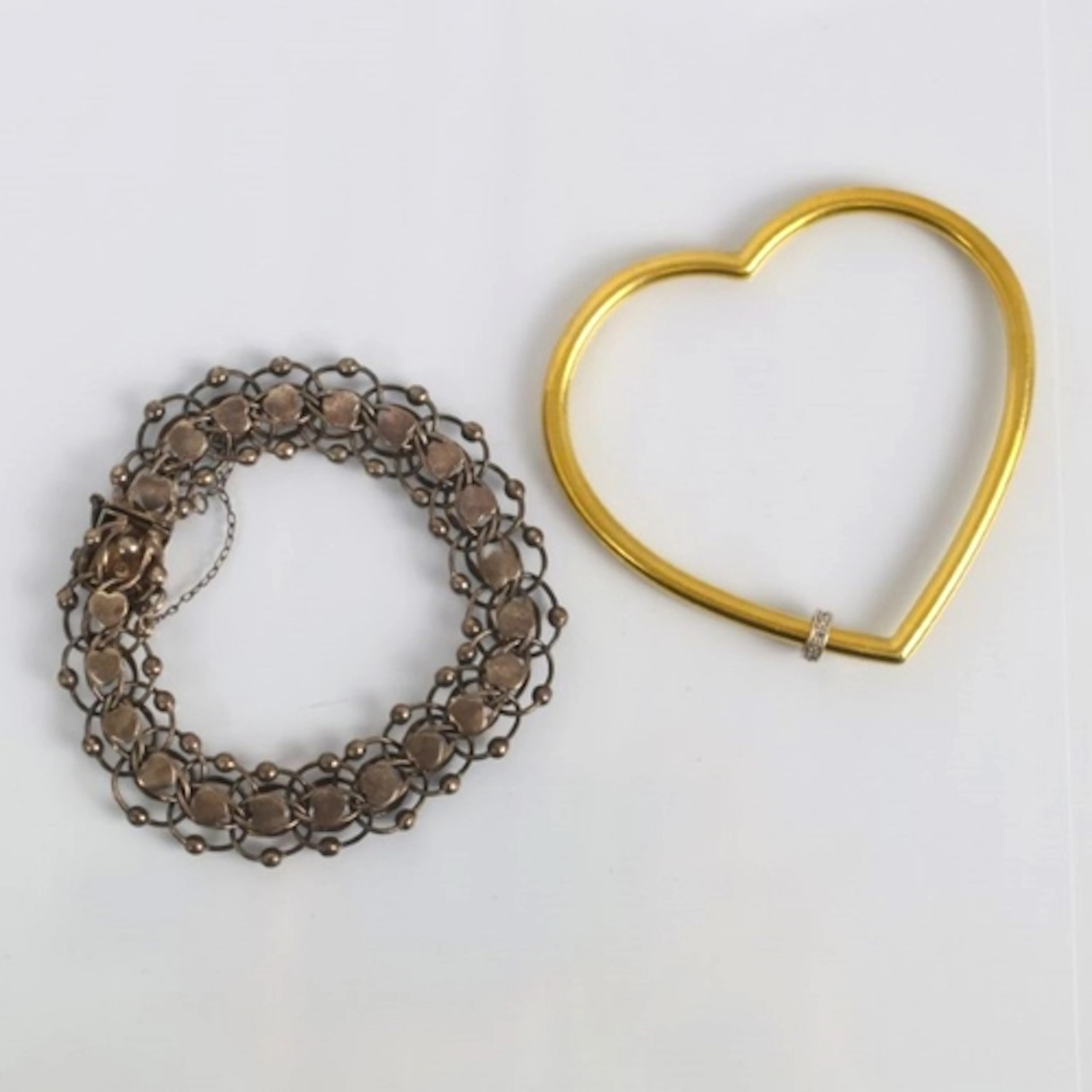A late 20th century heart shaped bangle, by Franklin Mint, t...