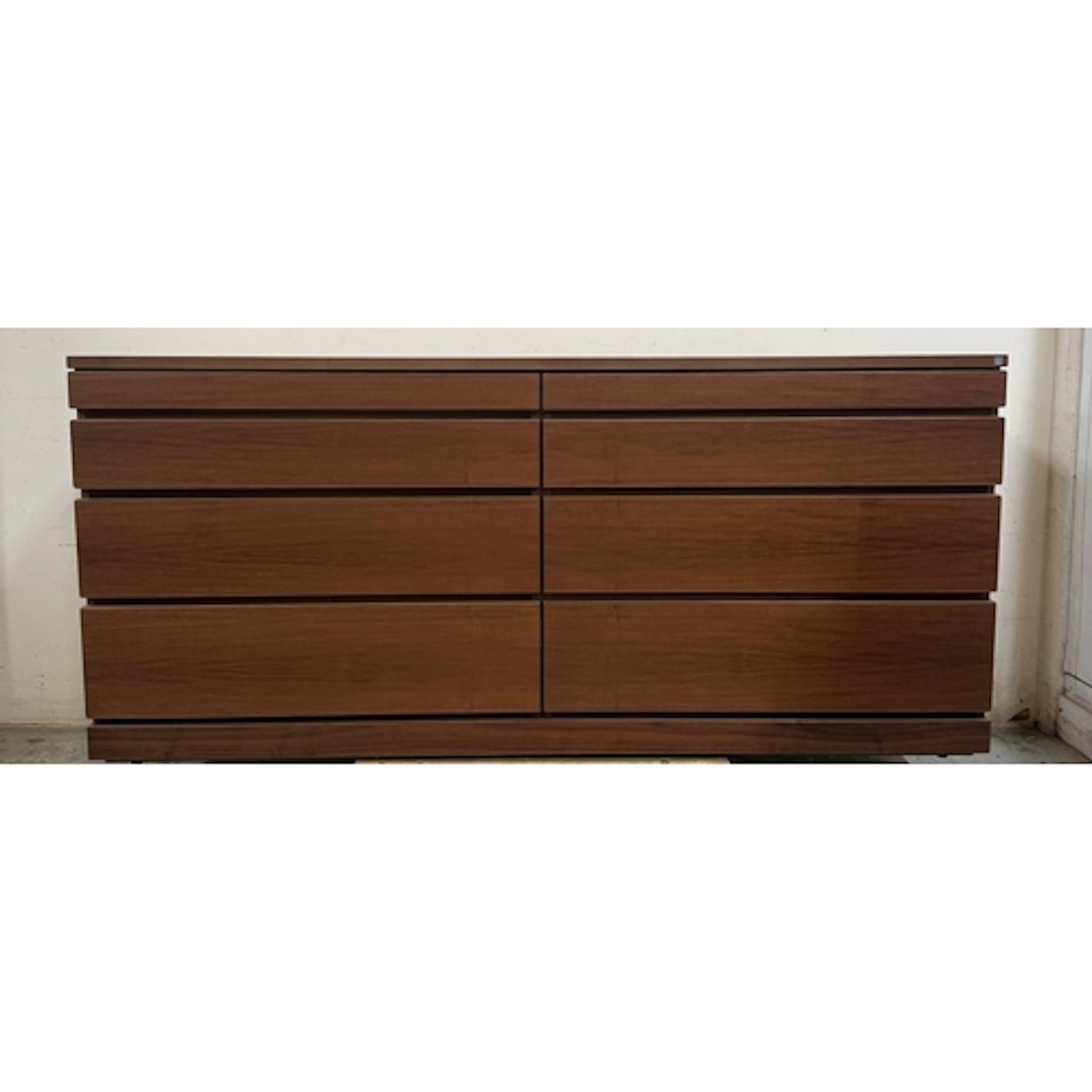 A Skovby dark wood side board comprising of eight graduated ...
