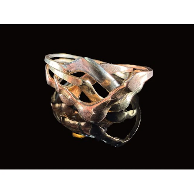 A yellow/white and rose gold four part puzzle ring, wishbone...