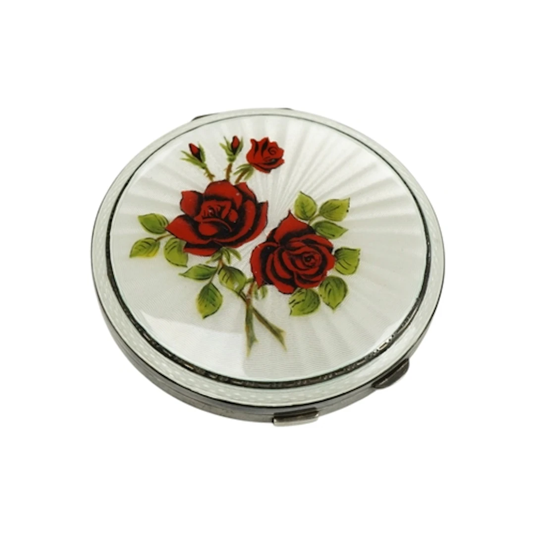 An Elizabeth II silver and guilloche enamel powder compact ...
