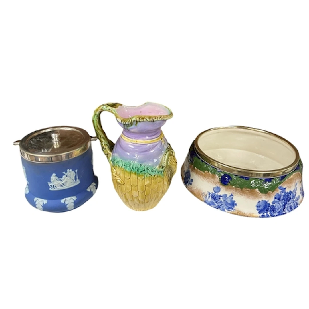 A Wedgwood blue jasperware biscuit barrel with silver-plated...