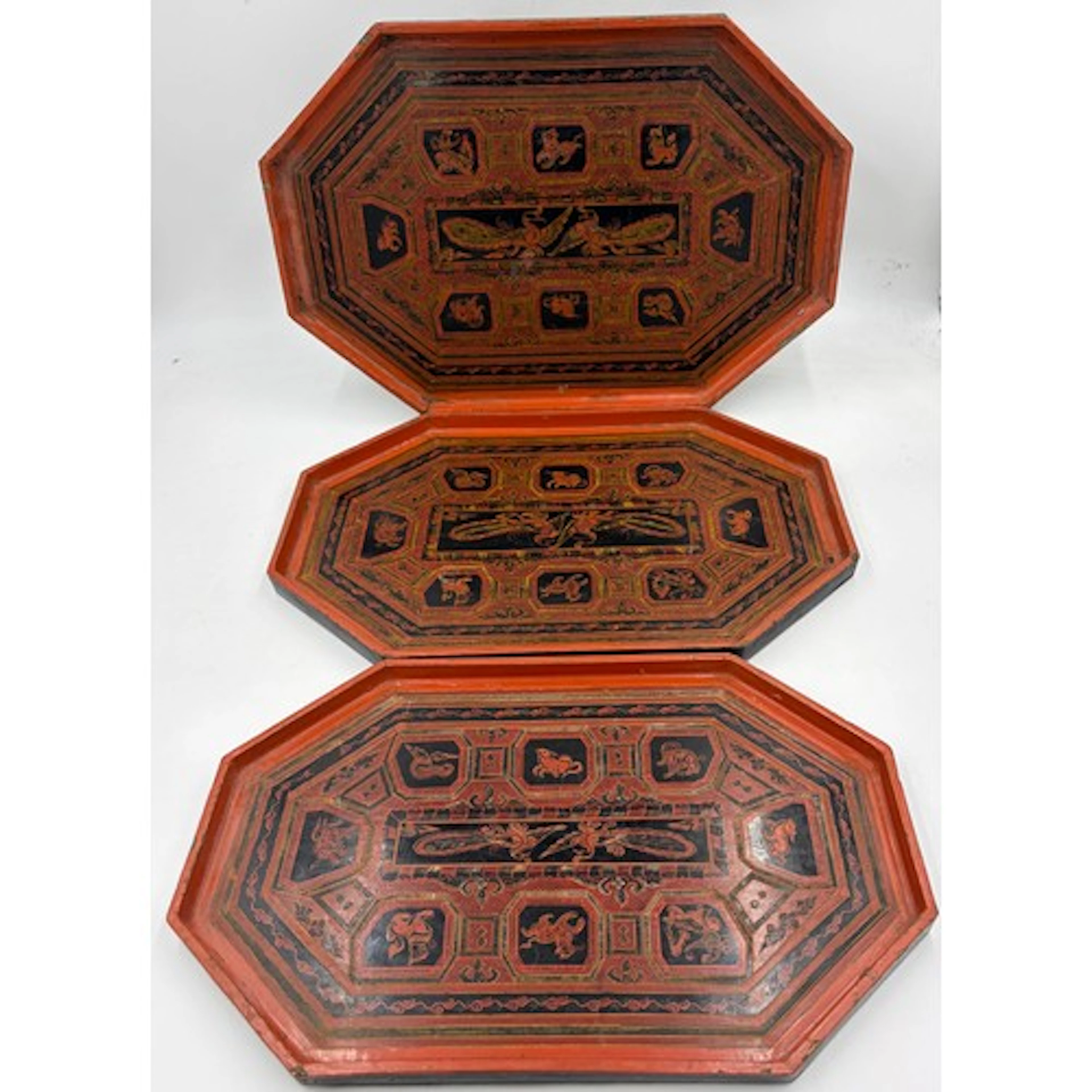 Three oriental lacquered handmade octagonal graduated servin...