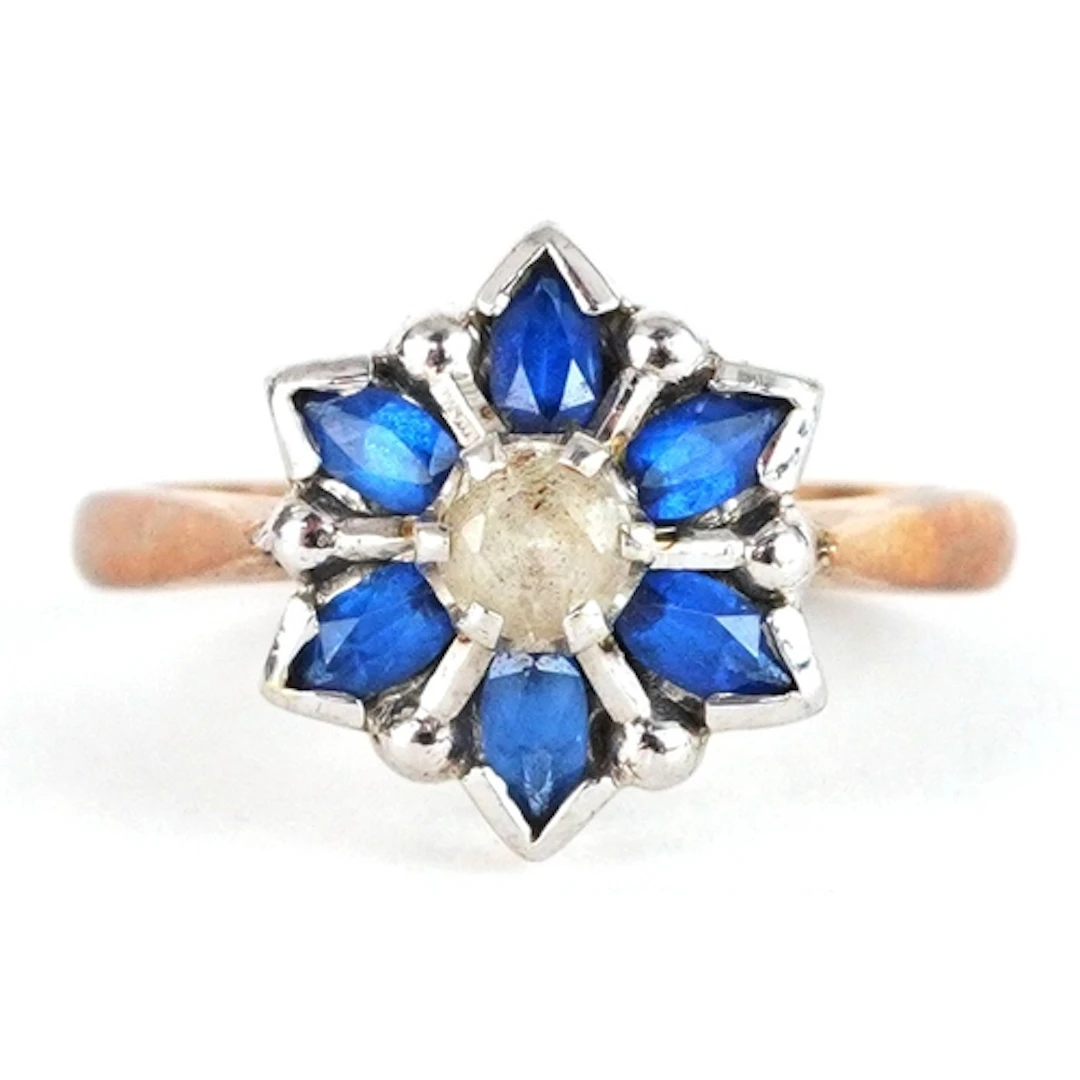 9ct gold blue and clear stone flower head ring, size L, 3.0g...