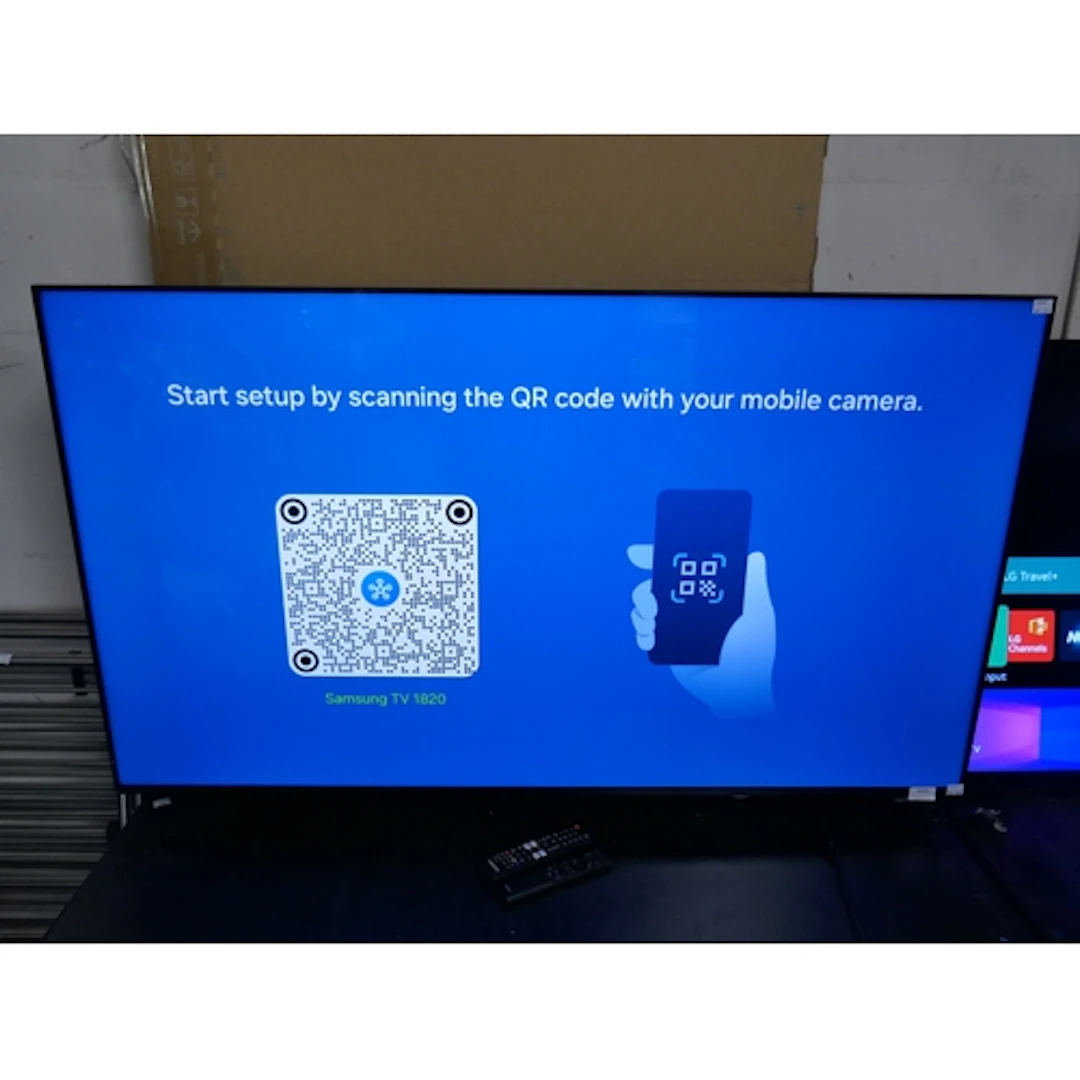 A Samsung 55" LED UHD Smart Television with two remotes, ori...