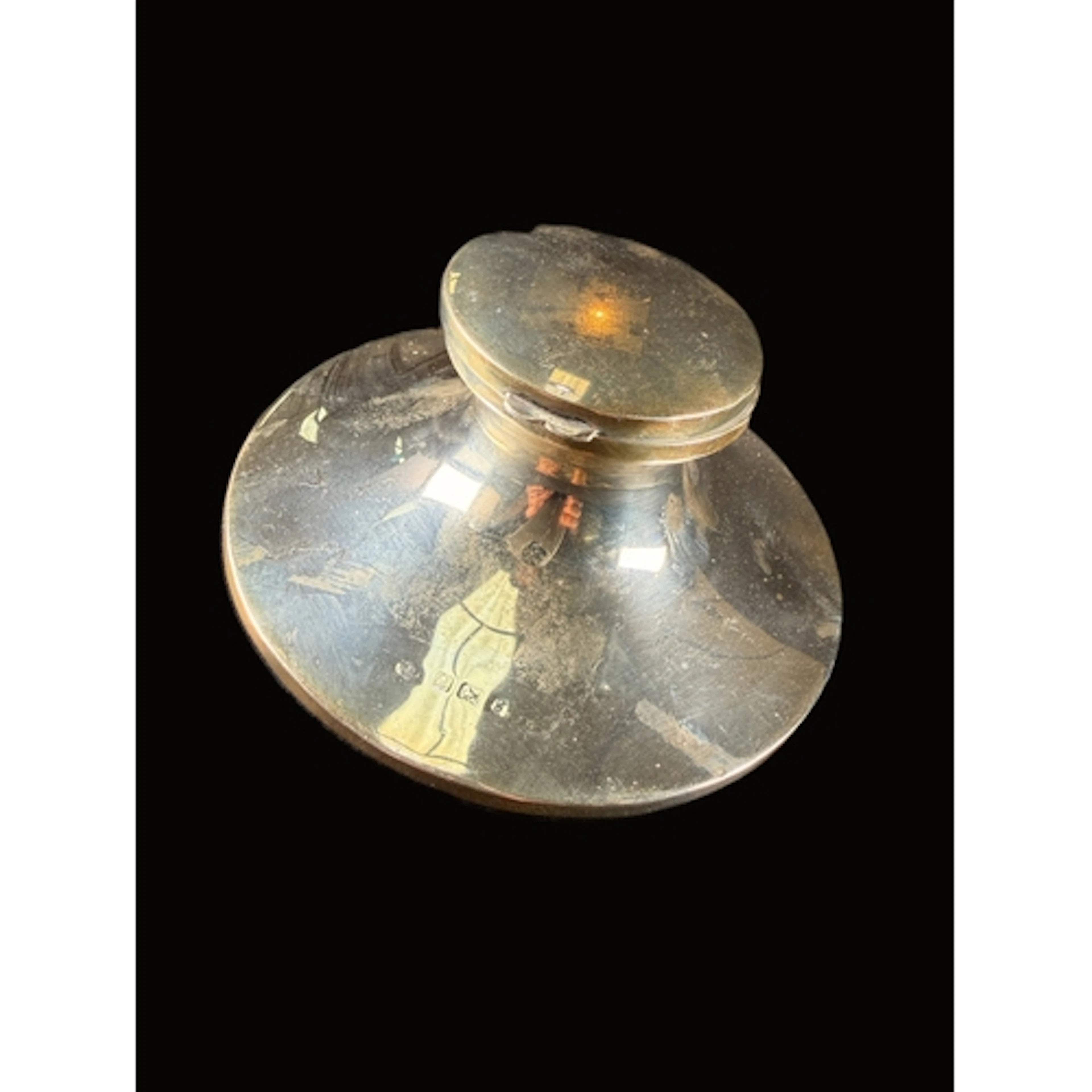 A hallmarked silver capstan ink well with hinged lid and wei...