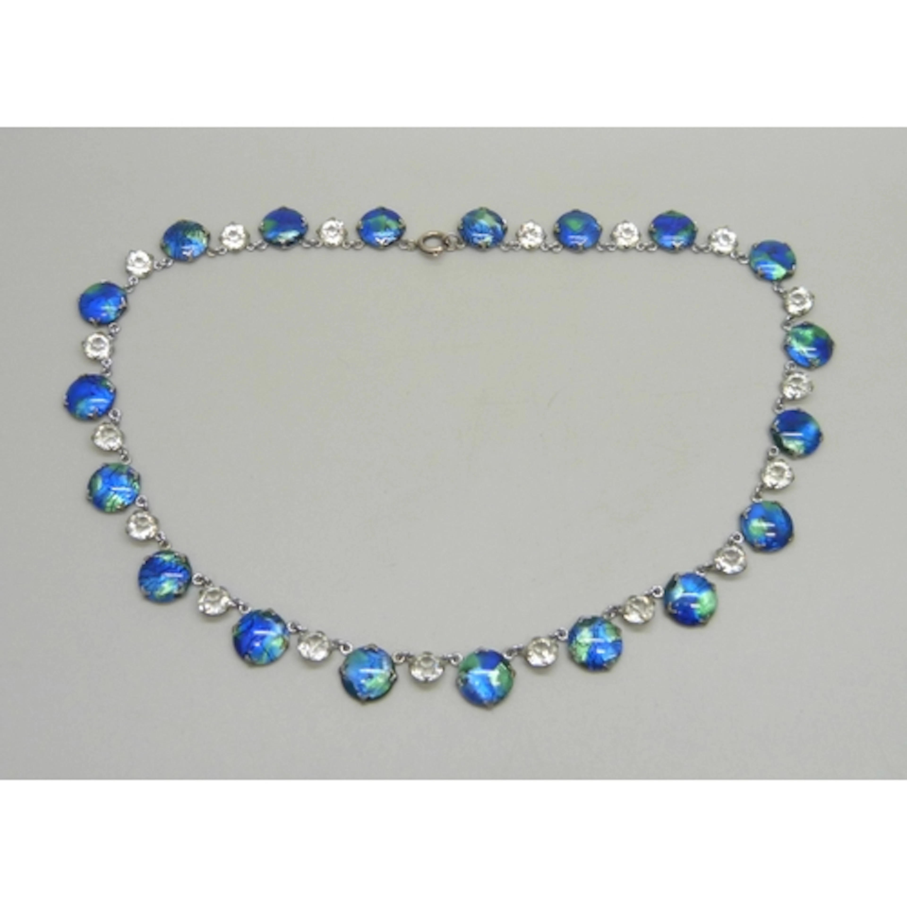 An Art Deco circa 1930s foiled blue/green glass and paste st...
