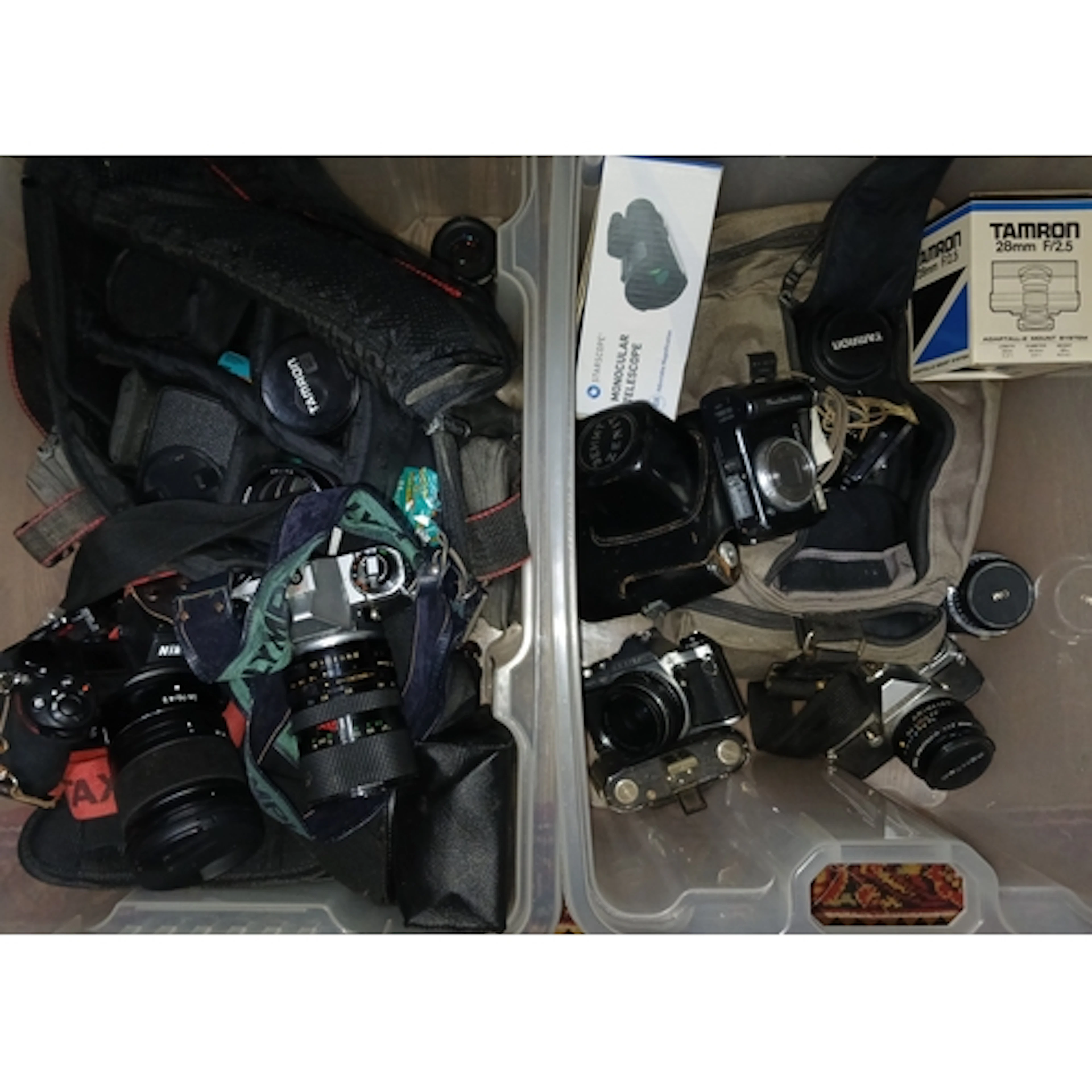 Two boxes of assorted cameras and accessories including Niko...