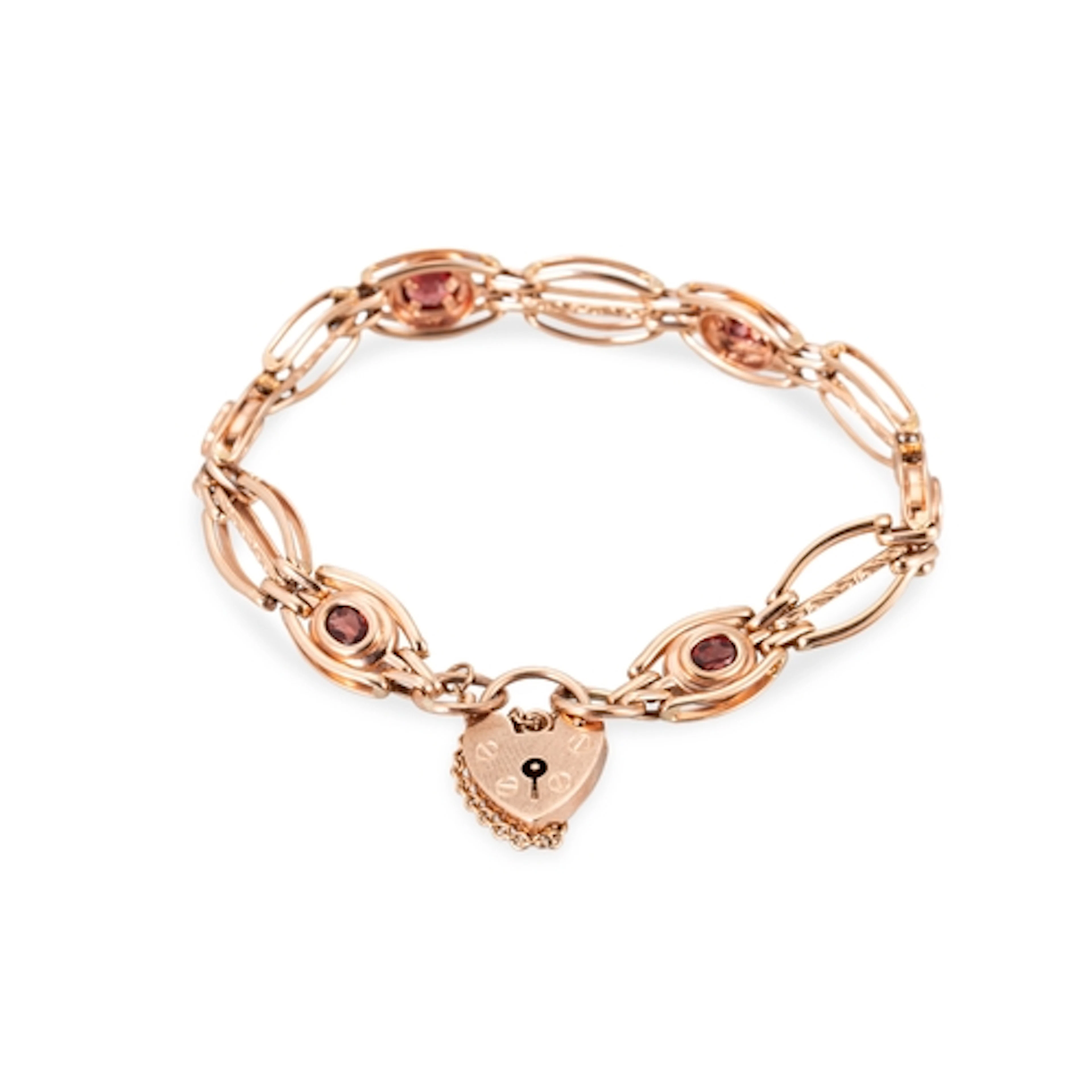 A 9CT ROSE GOLD GARNET SET BRACELET, with padlock clasp, 15....