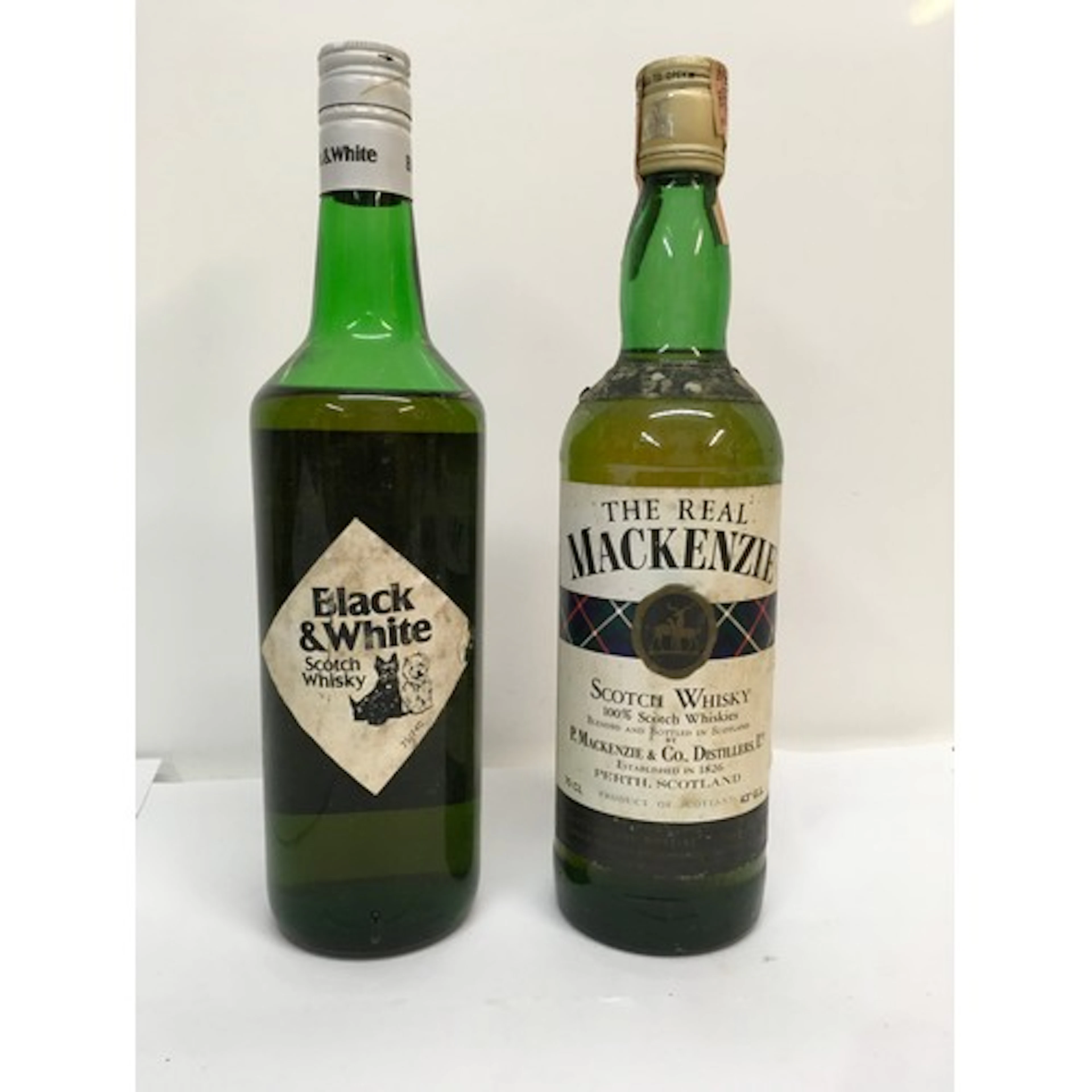 Two bottles of scotch whisky, ‘The Real MacKenzie’ and ‘Blac...