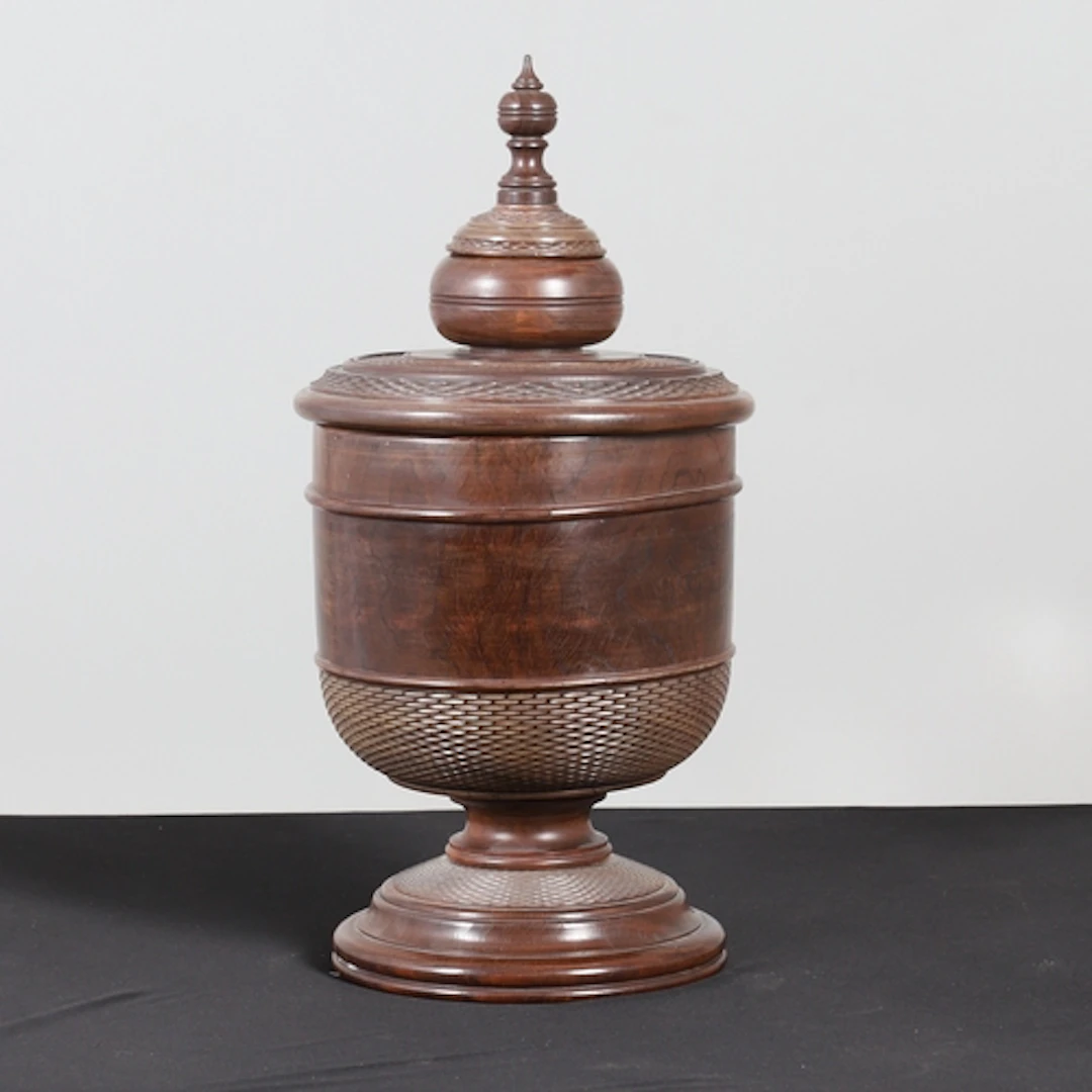 A LARGE TURNED LIGNUM VITAE WASSAIL BOWL AND COVER. first qu...