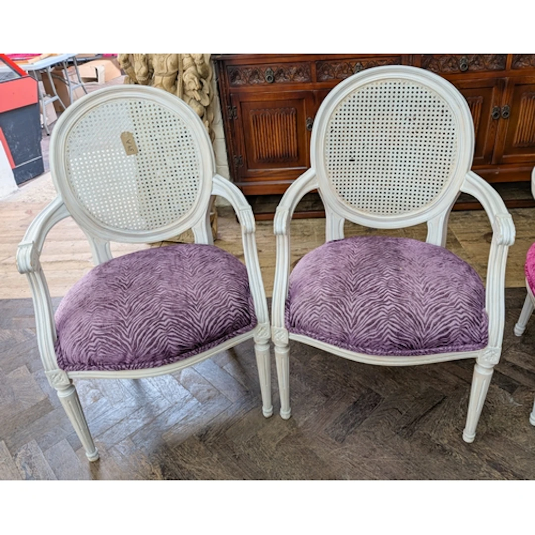 Pair of limewashed French style open arm chairs, with cane p...