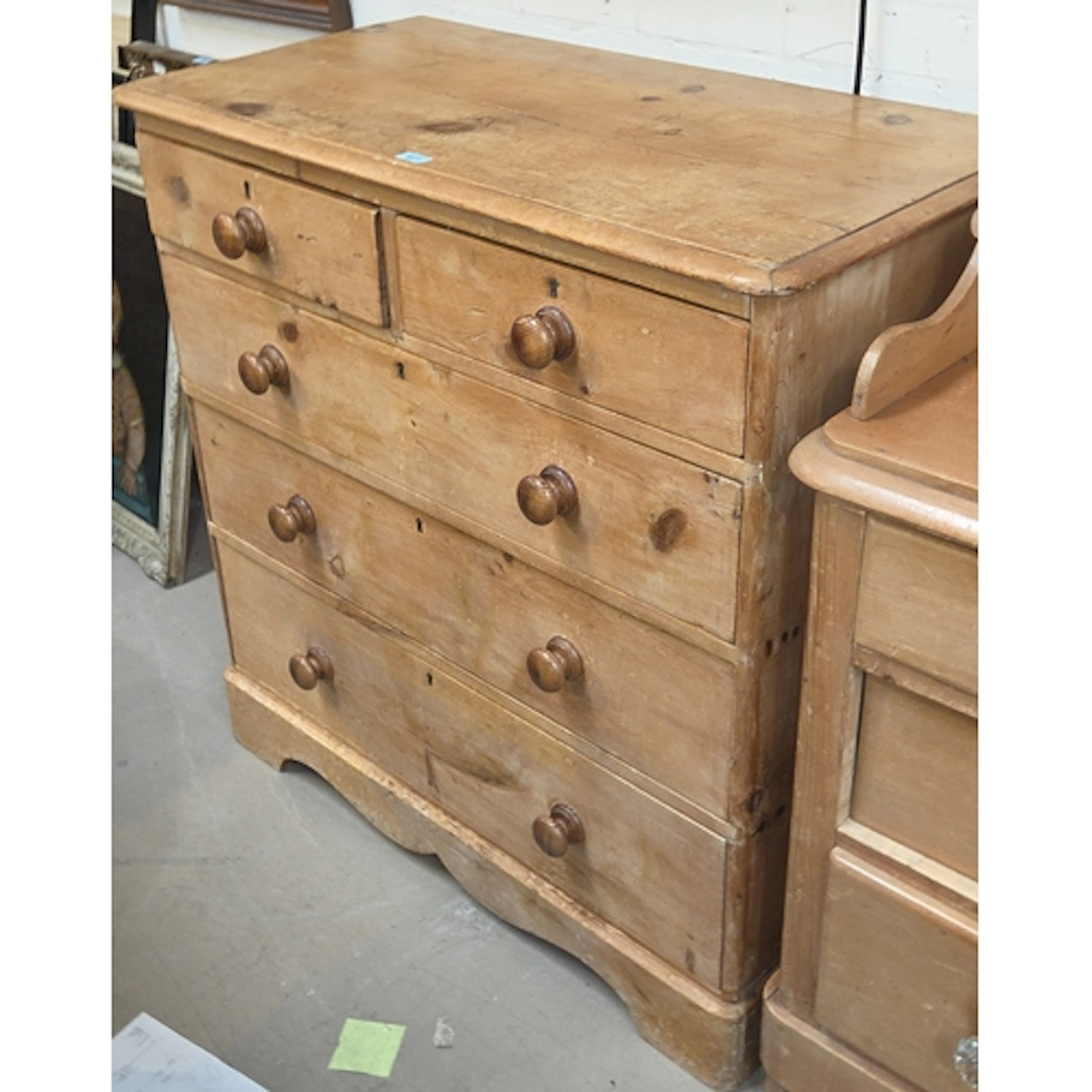 A Victorian stripped pine chest of three long and two short ...