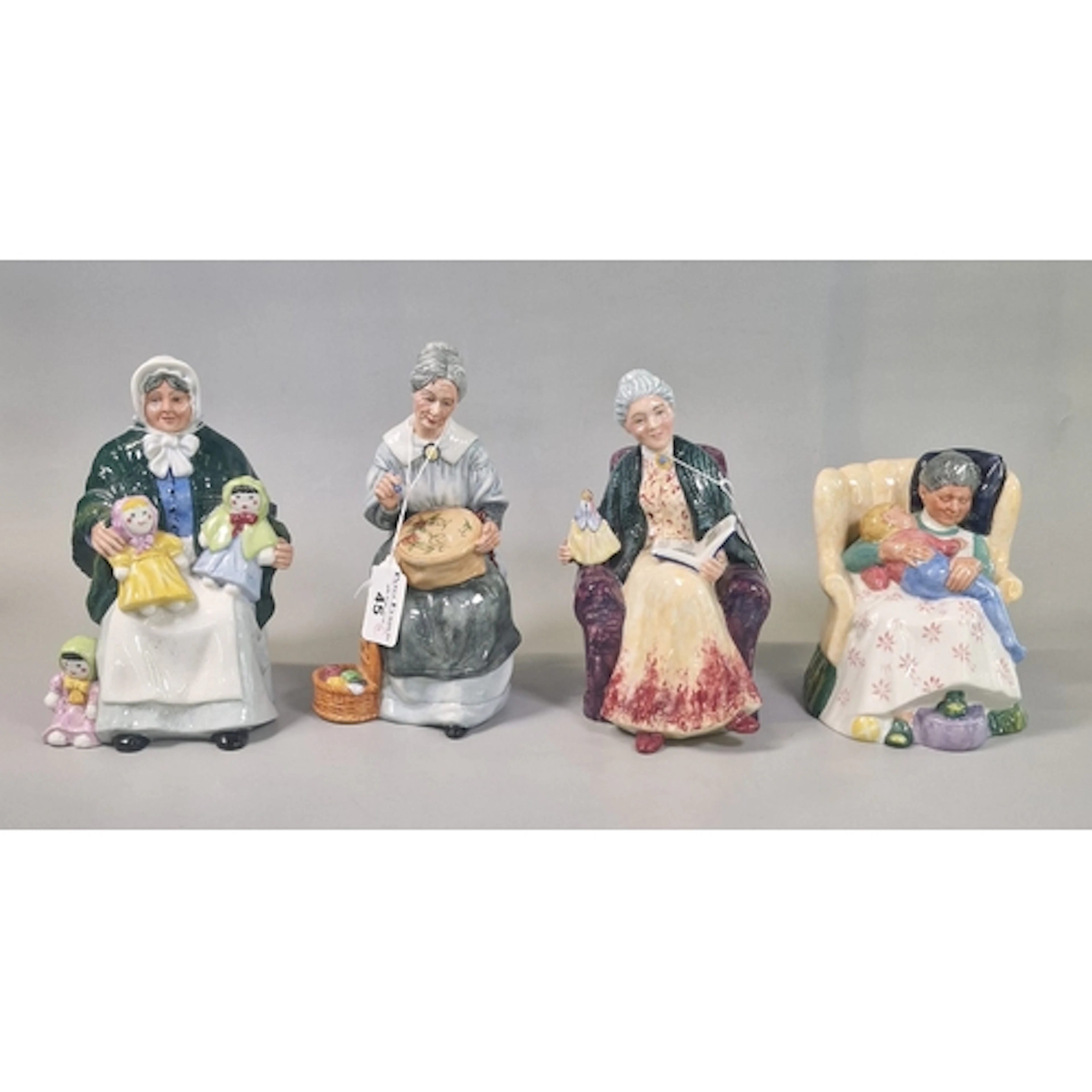 Four Royal Doulton bone china figurines to include: 'Embroid...