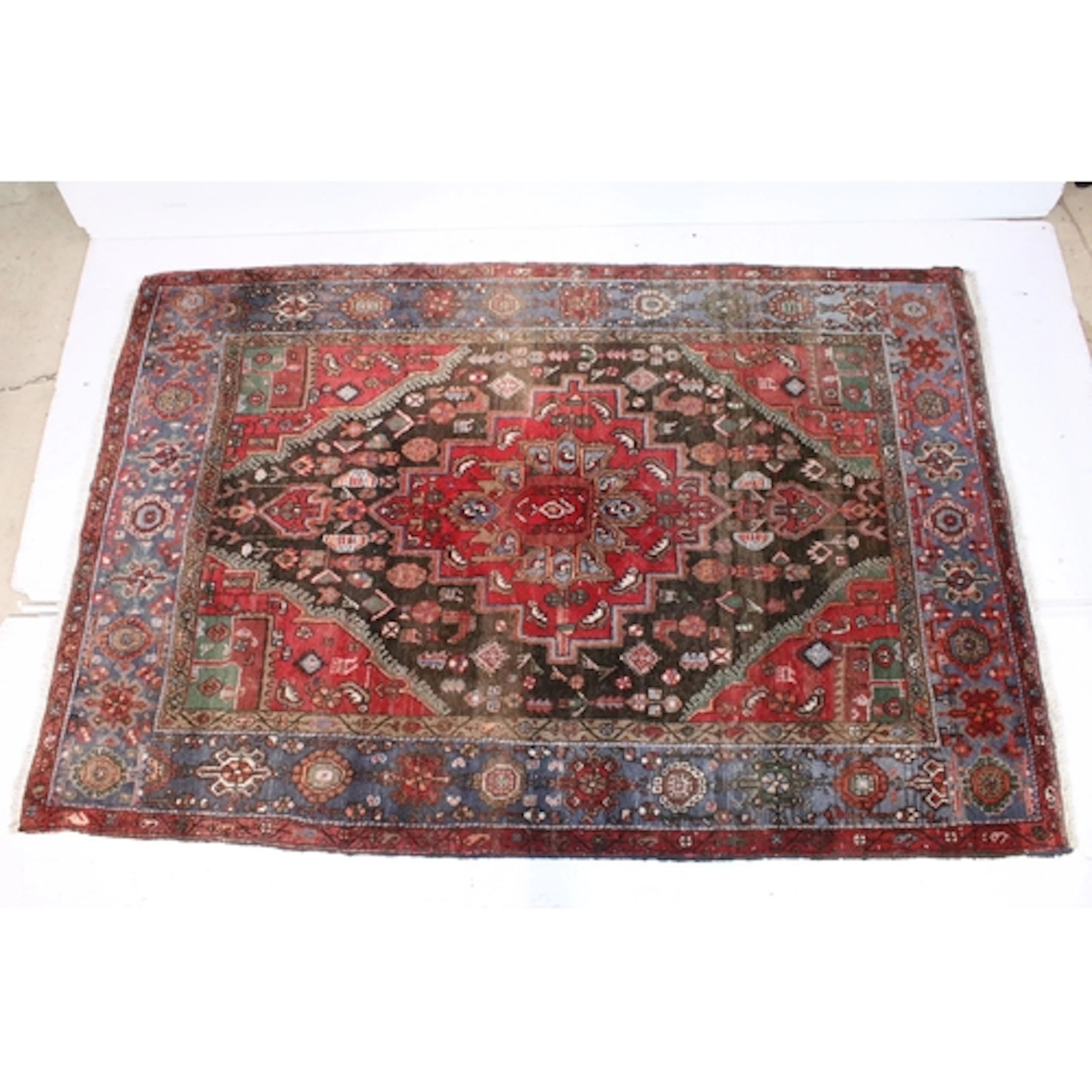 Turkish hand knotted red ground rug, having central medallio...