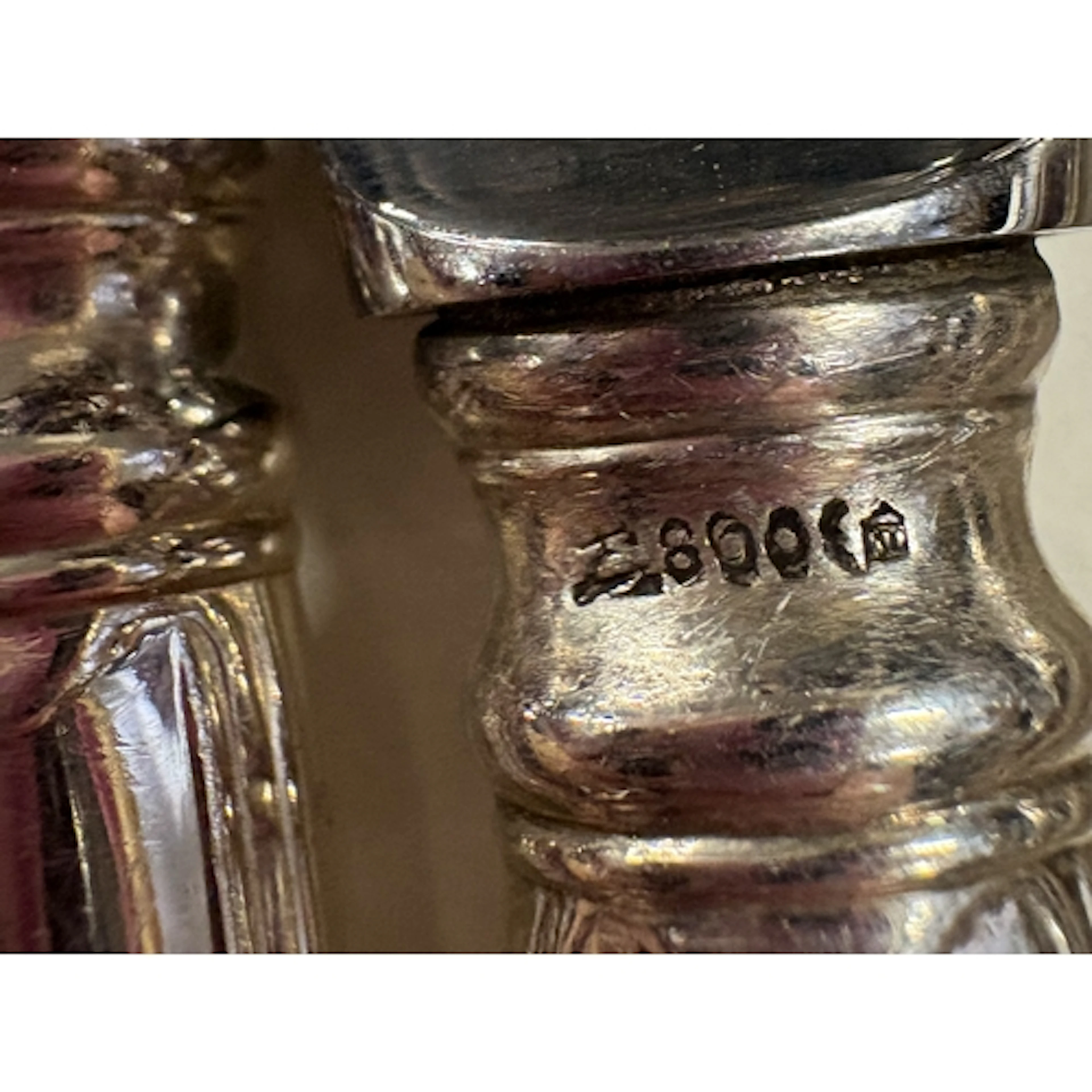 A collection of thirteen Continental silver-handled knives. ...