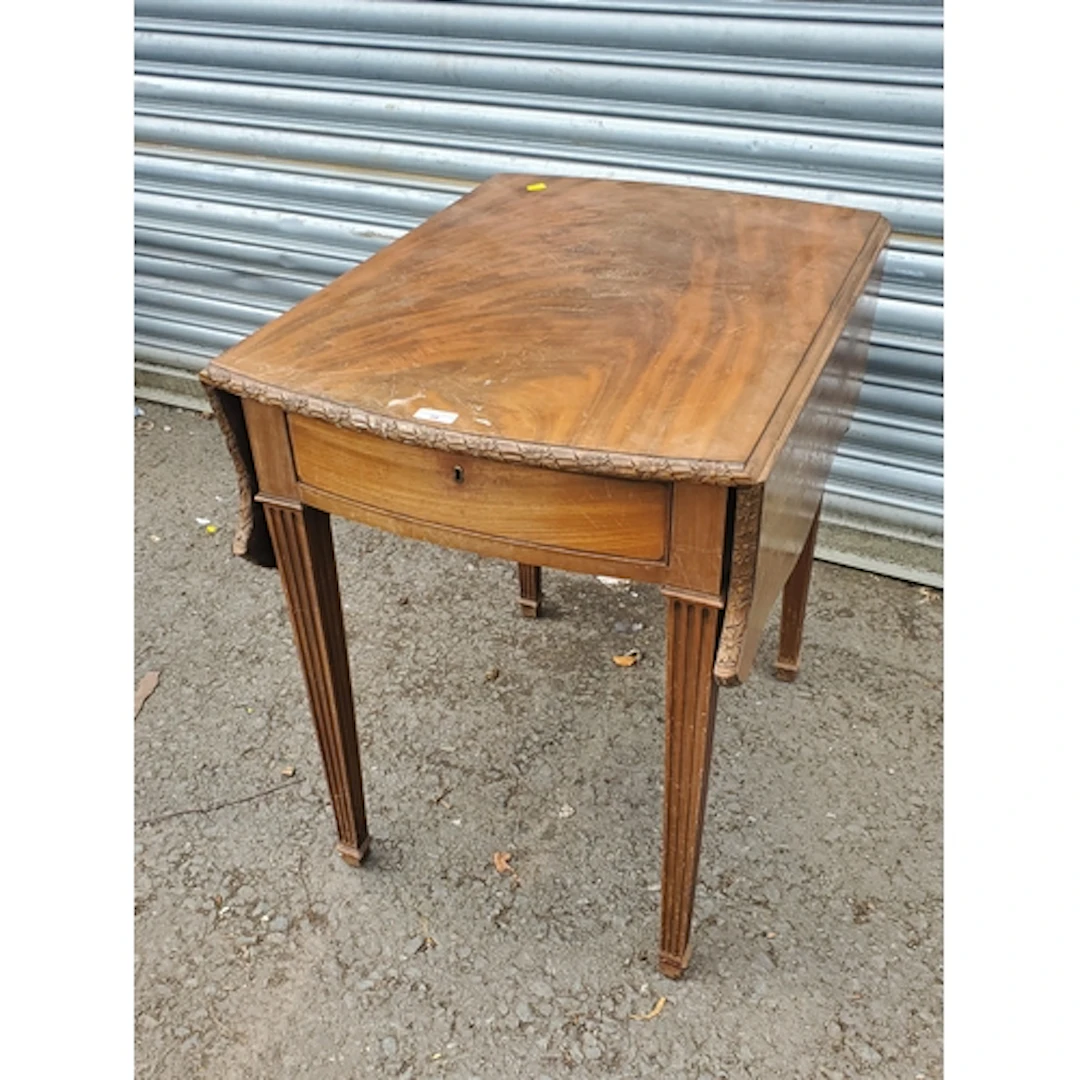 A Georgian style mahogany butterfly Pembroke Table on reede...