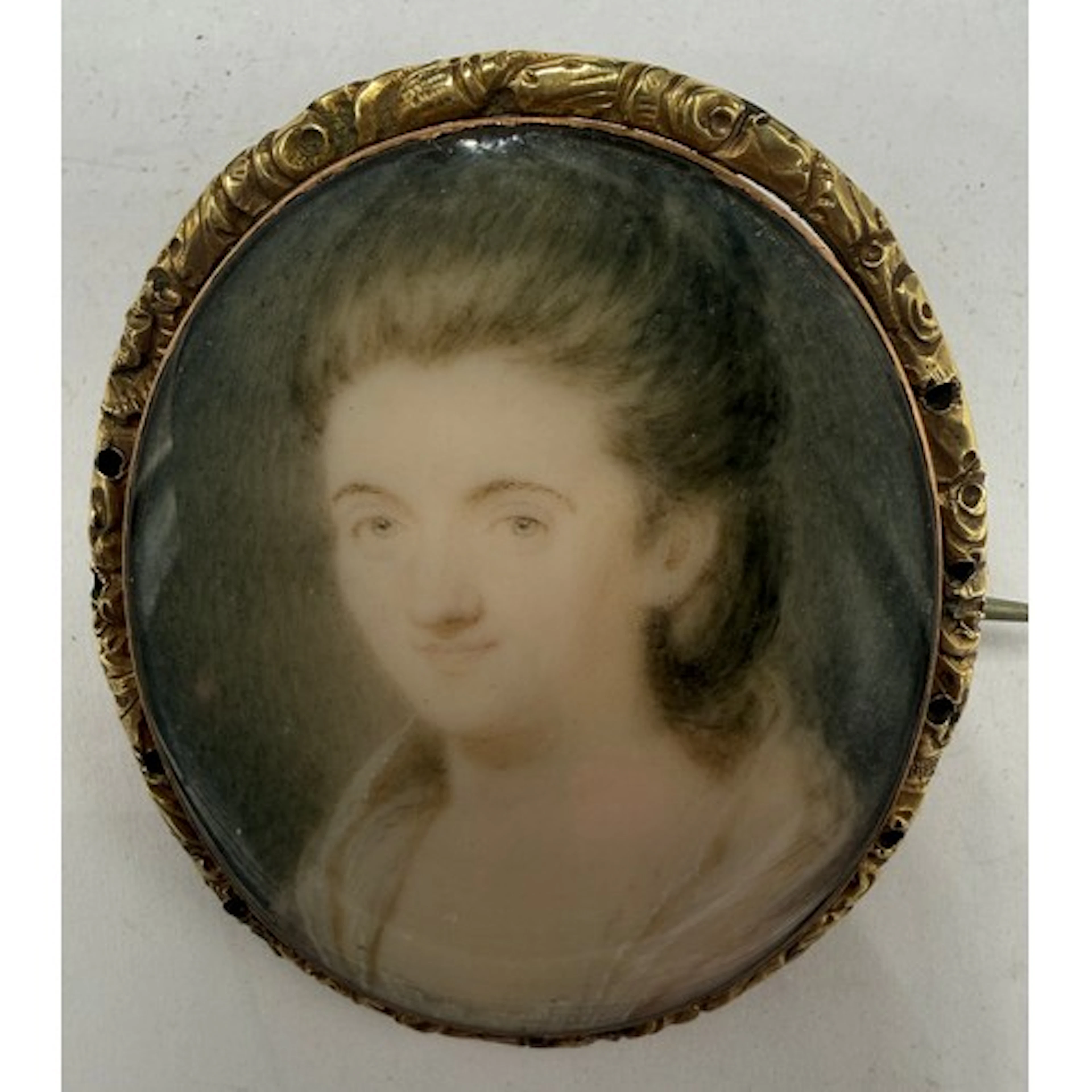 An 18thC brooch with miniature portrait of a lady on ivory, ...