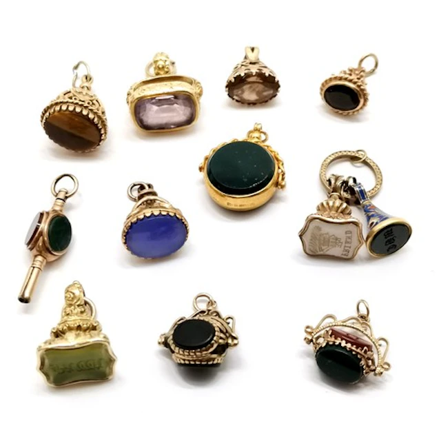 11 x gold seal fob pendants inc antique unmarked t/w unmarke...